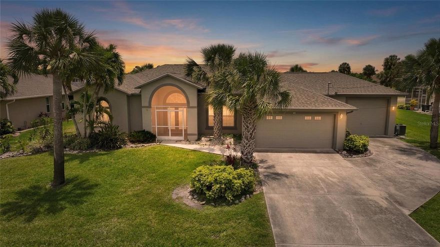 Located in the golf course community of Rotonda West, this 3 bedroom, 3 bathroom pool home offers spacious indoor and outdoor living with golf course views and an oversized 3-car garage. Situated on a lot and a quarter, the property features approximately 800 square feet of garage space, including a 400-square-foot third bay with a 9-foot door ideal for additional vehicles, storage, hobbies, or workshop space. The elevated front entry and double glass insert doors welcome you into a light-filled floor plan with transom windows throughout the home. Luxury vinyl flooring runs through the formal dining room, living room, primary suite, and second bedroom, while tile flooring covers the remaining areas. The living room features sliding glass doors opening to the covered lanai and heated pool area, creating a seamless indoor-outdoor flow. The spacious primary suite includes sliding glass doors to the lanai, a transom window for added natural light, a walk-in closet, and an en-suite bathroom with dual sink quartz vanity, soaking tub, and walk-in shower. The kitchen offers raised panel cabinetry, Corian countertops, stainless steel appliances, recessed lighting, tile backsplash, breakfast bar seating, a large pantry, and a pass-through window to the lanai. A large family room provides additional living space for entertaining or everyday comfort. The outdoor area is designed for Florida living with an extra-large covered lanai, expansive paver pool deck, heated pool, and golf course views. Roof replaced in 2022. Rotonda West residents enjoy multiple golf courses, nearby Gulf beaches, boating, parks, dining, shopping, and entertainment. Great opportunity for buyers searching for homes for sale in Rotonda West, golf course homes, or pool homes in Southwest Florida.