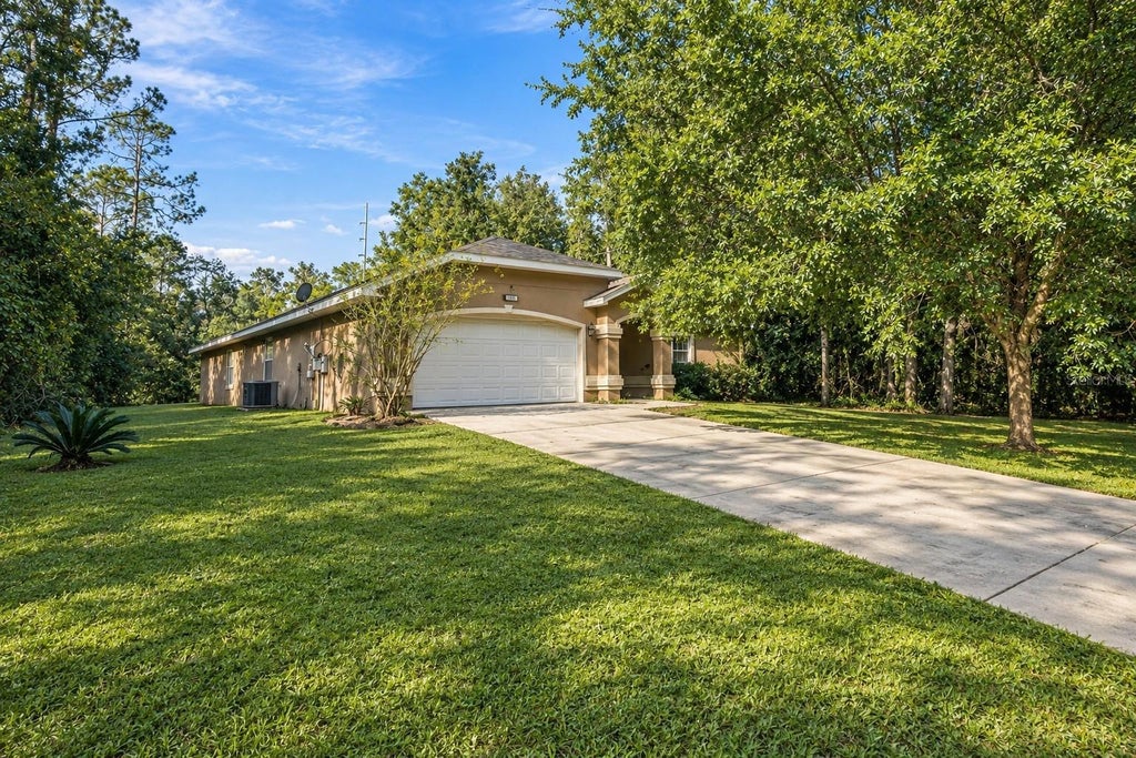 Photo of 9636 N Quarry Dr, Citrus Springs, FL 34434 (MLS # TB8562778)