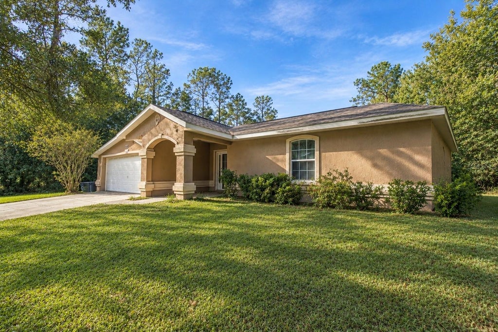 Photo of 9636 N Quarry Dr, Citrus Springs, FL 34434 (MLS # TB8562778)