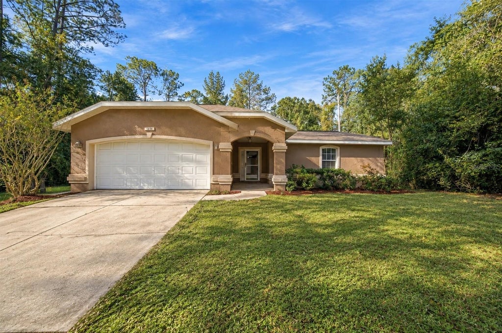 Photo of 9636 N Quarry Dr, Citrus Springs, FL 34434 (MLS # TB8562778)