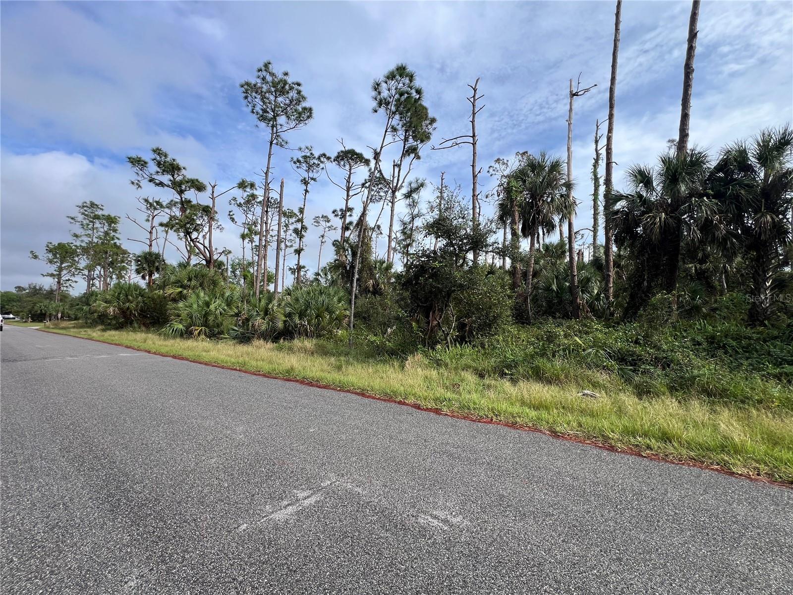Build Your Dreams in North Port, Florida. We have an amazing builder and floorpan if you need it! Imagine the possibilities with this vacant lot in North Port, one of Sarasota County’s most sought-after and fast-growing areas. Tucked into a quiet neighborhood, this property offers the ideal space to design your perfect home or craft a smart investment. Surrounded by natural beauty, this lot provides a peaceful escape while keeping you close to everything you need. You’ll find shopping, dining, schools, and medical facilities just a short drive away. Outdoor enthusiasts will appreciate the nearby parks, golf courses, and the sparkling Gulf beaches, where activities like boating, fishing, and hiking await. Conveniently located near major highways, this property ensures easy travel to Sarasota, Venice, and Port Charlotte, making work commutes or weekend getaways a breeze. North Port’s blend of community charm, thriving development, and rising property values make this a prime location for long-term growth and enjoyment. Whether you’re envisioning a forever home, a seasonal retreat, or an income-generating property, this lot offers endless potential. Seize the chance to create your slice of Florida paradise today! Not in a flood plain and the lot next door is also available.