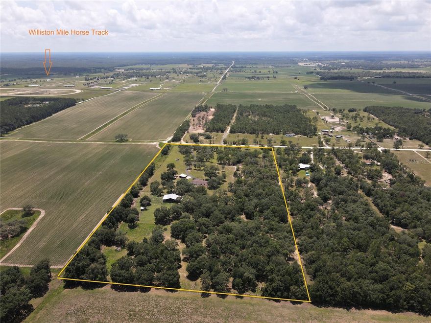 One of a Kind Homestead in the Country! Home & 20 acres located next to large farms providing the perfect remote setting for country living.  Views of the surrounding farmland provides quiet, peaceful, & private atmosphere for a tranquil lifestyle at home. Large 4 bedroom / 3 bath home with oversized covered front porch, great room, family room w/fireplace, large island kitchen, master suite w/study/den, utility room that opens to the back porch. Large open barn with 6 stalls, enclosed tack room, very large center aisle, outside lean to on north side of barn, and multiple paddocks connected to the barn area. Property is completely perimeter fenced, with multiple cross fences. Separate detached 3 car garage and workshop. Separate large open RV/car port with concrete pad. Manicured front entrance with asphalt drive & powered gate.  Truly a must see!