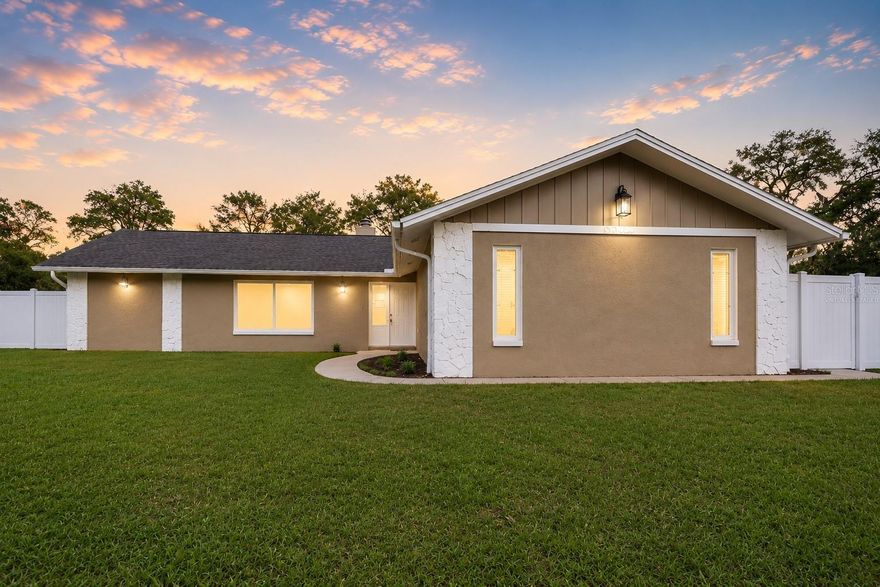One or more photo(s) has been virtually staged. Acreage Alert! Come check out this beautiful 3-bedroom, 2-bath block home located in the highly desirable Oak Ridge community of Trinity, Florida. Situated on 1.1 acres, this property offers privacy, space, and flexibility with a fully privacy-fenced yard, large back porch, utility shed, and plenty of room for a pool or detached garage. Inside, you’ll find an updated kitchen featuring granite countertops, beautiful laminate flooring, nice appliances, a cozy wood-burning fireplace, and a desirable split-bedroom floor plan. There is also a dedicated parking pad with room for boat or RV parking. Enjoy the benefits of well and septic for economical water expenses while still being conveniently located near Mitchell Boulevard and McMullen Booth Road with an easy commute to Pinellas County, State Road 54, and the Suncoast Parkway. Opportunities like this are rare, so schedule your showing today before this one is gone! This property may qualify for Seller Financing (Vendee).