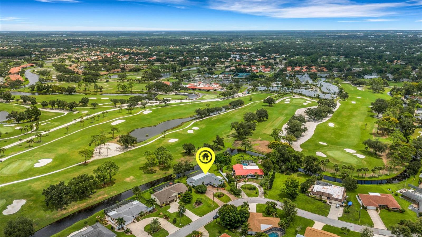 Bordering the breathtakingly beautiful Palm Aire golf course a very rare find! This nostalgic home is exceptionally well maintained and improved. Immaculate split ranch w/an outstanding huge paver patio with vaulted cage and featuring a fantastic outdoor grill covered cook station. Garage for car enthusiast with black/white tile floor, workbench and great lighting. Home has updated baths and kitchen. PGT thermopane windows installed. Tiled thru-out except master bedroom. Non-deed restricted. New Roof. Exceptional wide open golf course views of multiple fairways and separated by meandering stream. Membership is not required, however for those who desire a country club The Palm Aire Country Club is an active, warm and welcoming member owned equity club open for membership. But is not mandatory or required. Two stunning 18 hole championship golf courses. The club also boasts both tennis and pickleball, featuring 8 Har Tru lighted tennis courts for evening play, and 8 lighted paddle courts for the pickleball enthusiasts. Incredibly well maintained and updated nostalgic home. Must see to appreciate!!!