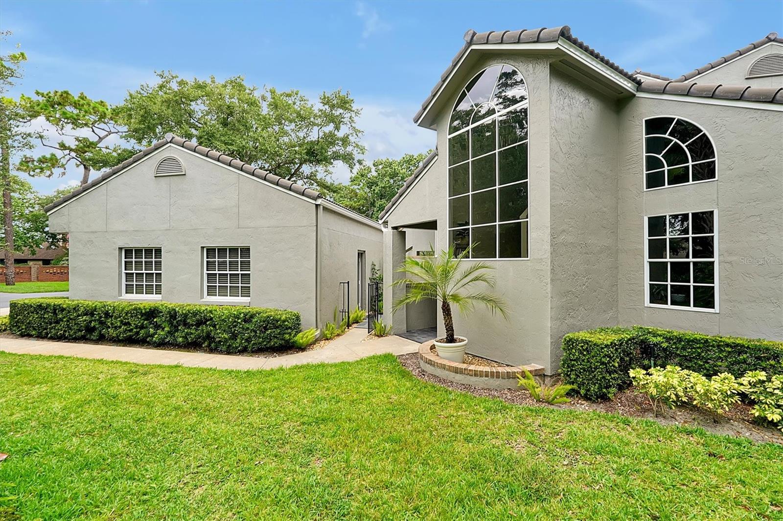 Wow! The Sellers spared no expense in updating this STUNNING 3 bedroom 2 1/2 bath Condo in the sought-after, MAINTENANCE-FREE COMMUNITY of Wekiva Hunt Club. Virtually everything has been updated or upgraded from top to bottom starting with the attractive slate tile walkway leading up to the entrance. As you enter, on your right you'll quickly be drawn to the gorgeous kitchen featuring new state-of-the-art, white glass SAMSUNG BESPOKE APPLIANCES, new striking QUARTZ COUNTERTOPS, and newly painted white custom cabinets with soft-close drawers. The kitchen opens to the spacious living and dining room which features a WELL APPOINTED WET BAR and a real wood-burning fireplace, tastefully updated with travertine tile. The newly painted soothing white interior along with soaring vaulted ceilings and NEW BLONDE OAK LUXURY VINYL PLANK FLOORING create a light and airy setting. New French doors open to the enclosed porch perfect for enjoying a glass of wine at the end of a long day. The Master bedroom suite is also conveniently located on the main floor with a completely renovated spectacular spa-worthy Master Bath highlighted by a frameless glass shower encased with designer tile and dual vanities with quartz countertops. Completing the downstairs, there's a half bath along with the laundry room which includes a new washer and dryer. There's also a door leading to a charming private courtyard that has endless possibilities, including another great spot to chill with your favorite glass of wine or beverage of choice. The courtyard also connects to the 2 car garage via a matching slate tile walkway. Heading upstairs the thoughtfully designed floor plan has 2 nice size guest bedrooms and a full bath updated with the same design flair and finishes as the main floor. The seemingly endless upgrades and high-end finishes in this rarely-for-sale end unit condo also include a 2018 tile roof, new 2022 AC, a new hot water heater, new 7-inch baseboards, newly tinted windows, new plantation shutters throughout, and more... To top it all off this home is ideally located in the heart of Wekiva, with its many parks and walking trails not to mention a stone's throw from the Wekiva Golf Club and just minutes from beautiful Wekiva Island. Hurry! This one won't last long!