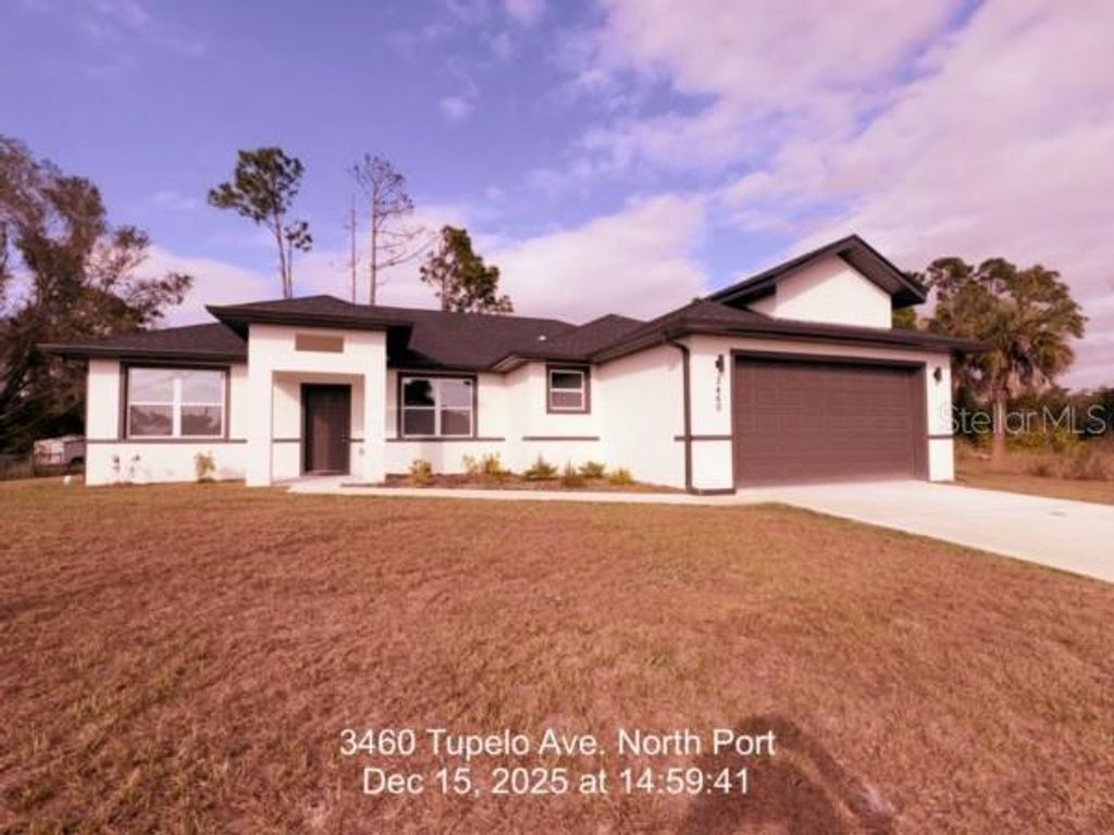 Photo of 3460 Tupelo Avenue, North Port, FL 34286 (MLS # D6145655)