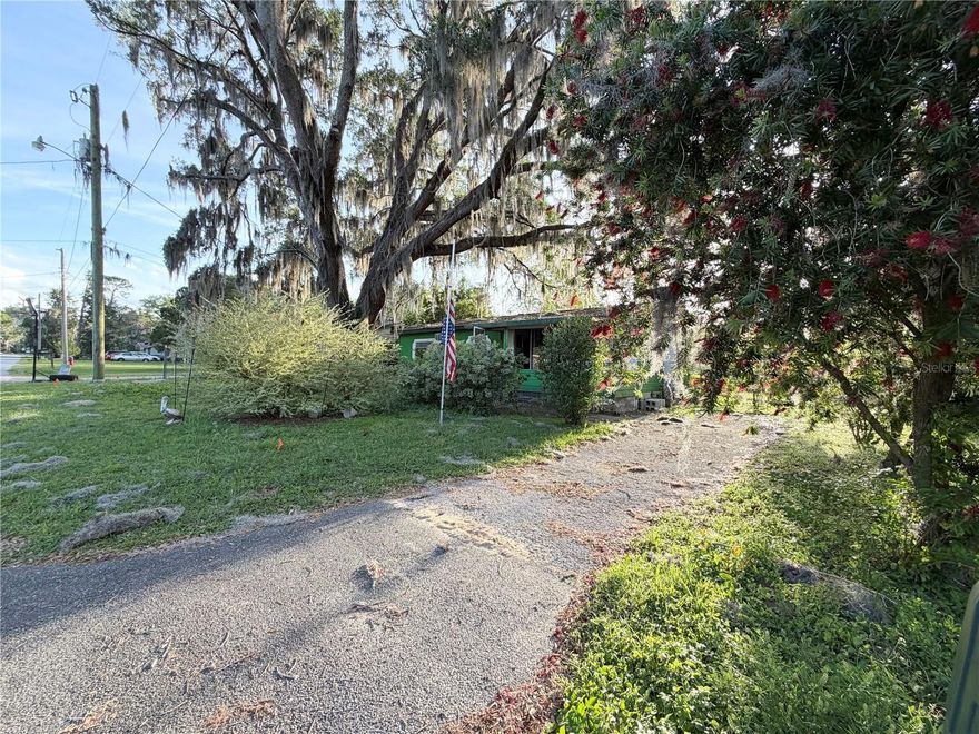 Prime location with a fenced lot in Ocala. This property is perfect for investment or rental.  Nice .30-acre lot with mature trees and landscaping. This is a fixer upper and will need to be rehabbed to make it a cute home again!! ROOF 2023!! This home features 3 bedrooms, 1 bathroom, 800 sqft, a covered front porch, accessible ramp, kitchen, living room, dining area, drive-thru gate to the backyard, window unit AC, and double parking. Shed 8x19 in great condition is included.  NO HOA! Convenient location near shopping, medical and restaurants.