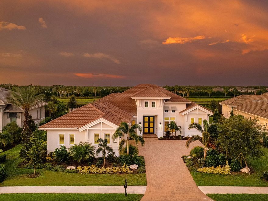 Welcome home to the ideal residence in The Lake Club with gorgeous private water views! One of the most desirable floor plans is this 2023 home offering a coveted separate casita guest house, plus a modern open plan, luxurious primary suite, 3 additional guest bedrooms all with private en-suite bathrooms, study, and expansive air-conditioned 3-car garage. The exterior invites you home with 2025 freshly painted exterior, updated lush landscaping, and wide driveway with parking pad. This residence is filled with clever upgrades that make daily life more enjoyable including IMPACT windows and sliders throughout, security camera system, Wi-Fi extenders, in-ceiling speakers, whole-house water filtration and softener system, Lutron lights, smart home systems, plantation shutters, and wood-look porcelain tile flooring throughout. The great room opens from the foyer with frosted impact glass front door straight onto the lanai through pocketing impact sliding glass doors, offering immediate views of the lake and greenspace beyond, plus a custom ceiling with hand-stained wood beams. The chef’s kitchen offers impressive upgrades with an expanded island for extra seating, upscale quartzite counters, custom cabinetry, reverse osmosis, TWO custom walk-in pantries, and high-end appliance suite with 36” side-by-side Sub-Zero refrigerator and freezer, Bosch dishwasher, Wolf dual wall ovens, Wolf gas cooktop and Wolf microwave drawer. Enjoy meals in the dining room featuring a custom dry bar with wine refrigerator and disappearing corner impact sliders. This Florida home was made for an ideal indoor-outdoor entertaining lifestyle with covered dining and living areas on one of the largest lanais in the neighborhood at 3,382 SF. Relax under tray ceilings with oversized modern fans on the travertine lanai; lounge in the sunshine surrounded by the 2024 panoramic extra-strong stainless steel screen enclosure; or dine next to the outdoor kitchen complete with island, stone counters, reverse osmosis, and high-end appliances including Wolf grill, U-Line beverage refrigerator, separate ice maker and Bosch dishwasher. The sparkling saltwater pool is oversized, perfect for swimming laps or splashing in the afternoon, and features a sunken spa with spill-edge perfectly positioned to take in the lake views. Inside the owner’s suite offers the ultimate relaxation with tray ceiling, seating area, French doors to the lanai with a porch area and two custom walk-in closets. The primary bathroom rivals a five-star hotel with separate vanities, large linen storage tower, water closet with Toto toilet, freestanding modern tub, walk-in shower with rainhead and 4 body sprayers. Guests will enjoy their own 3 bedrooms all with their own private and luxurious en-suite bathrooms. Plus the rear bedroom can be used as bonus room with a full pool bathroom for even more flexible spaces. The guest house casita is ideal for long-term guests, teens, live-in assistance, an in-law suite or a second office with a large studio bedroom, kitchenette wet bar, private lanai area and en-suite bathroom. Completing this residence is a private study, spacious laundry room with hidden ironing board and guest powder bathroom. The air-conditioned and insulated 3-car garage offers expanded room for cars and toys, 2 AC splitters, custom storage and a dual electric car charger. The Lake Club is an exclusive premier, gated community with a Grande Clubhouse, restaurant, pool, tennis, pickleball and more.