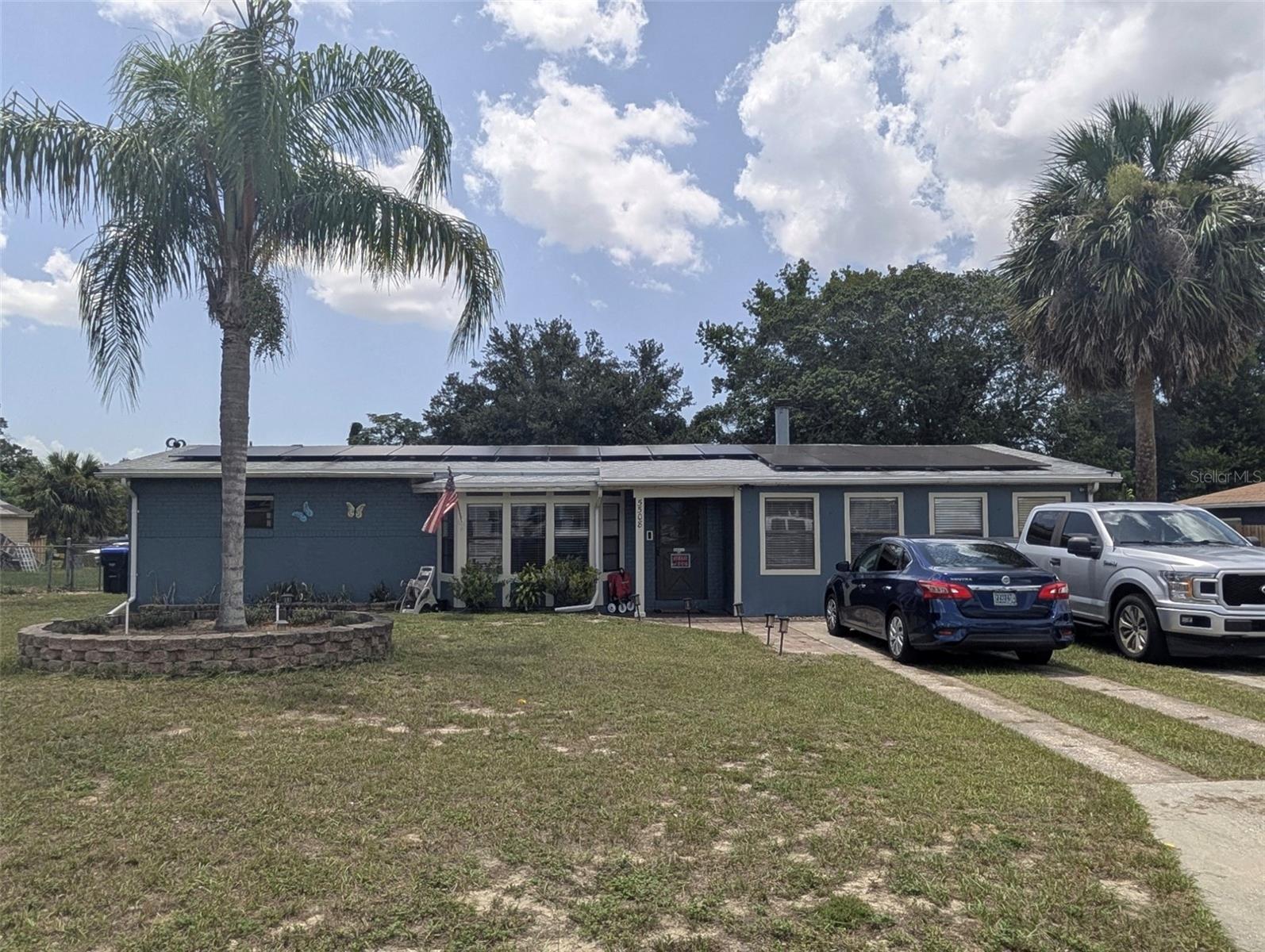 One or more photo(s) has been virtually staged. This is your OPPORTUNITY! Come and see this CHARMING HOME in Orlando, FL with NO HOA and NO CDD! ROOF was installed on NOV 2021, tankless water heater is 3 years old. Home includes solar panels that helps with the energy consumption and saving. Solar panels would be paid off by the seller!!! Buyer's gain!!! EFFECTIVE YEAR BUILT 1985! As soon as you enter you can appreciate the spacious living room with wood flooring! In the living room a gorgeous chimney is situated for you to enjoy decorating or if needed to be use during winter time. The dining room and kitchen are spacious for you to enjoy and for gatherings and special moments. Both bathrooms are updated giving a touch of modern style. Master bedroom has a walk in closet with a built-in shelving giving you more space for storage. On your way to the back yard you will find the roomy laundry room. If you enjoy the outdoor living this home is for you. Come and see the immense backyard with plenty space for events, boats, etc. Schedule your showing today for this hard to find home in Orlando!
