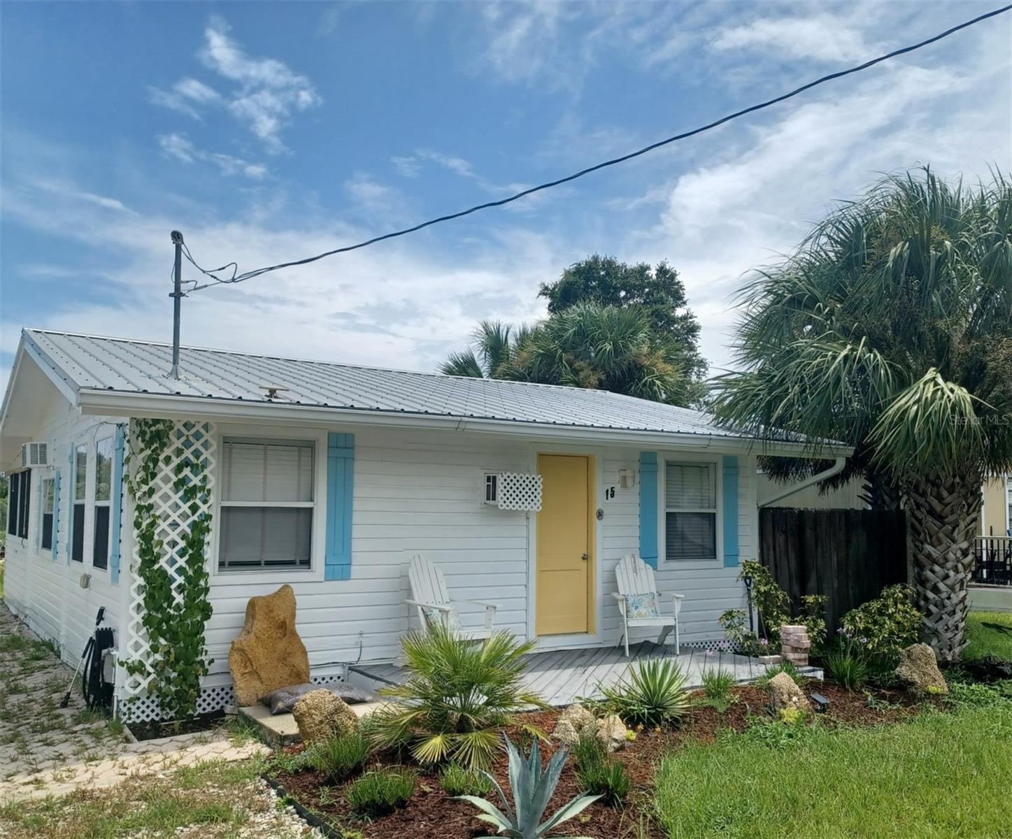 If you’ve ever wanted to have your own beach getaway, this cute costal cottage is perfect! This home is a gem, move-in ready; it comes beautifully decorated and FULLY FURNISHED, including all the décor, bedding and also comes with a fully stocked kitchen. The main house has one bedroom and one bathroom, kitchen, and a spacious living/dining room combo which is light and bright, just like a beach house should be. A bonus bunkhouse bedroom across the rear courtyard is perfect for guests. A huge 10ft wide rear patio runs the full width of the house and contains the washer/dryer combo. The patio has a roof and screened windows with extra privacy pull shades, giving a perfect shaded outdoor space for breakfast, entertaining, or just enjoying the warm Florida evenings. No rear neighbors or an HOA. But it’s the LOCATION! This neighborhood is an overlooked haven with unique charm, a hidden, well-kept secret. Only minutes walking distance east to the beach and approx. the same distance on the west to Bing’s Landing, which has an Intracostal boat ramp. No need to take the car, you can walk, bike or take the golf cart! Lots to do here too, canoeing, kayaking, jet skiing, boating, golfing, fishing, walking trails and numerous bike trails, and although there are restaurants and grocery shopping close by, there’s lots more over the Hammock Dunes Bridge only minutes away. St. Augustine, Washington Oaks State Park and Flagler Beach are close by too. This home is a must to view.