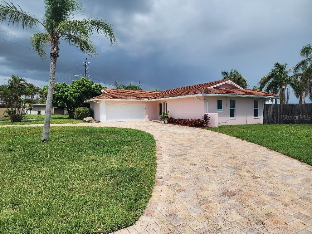 UPDATES JUST COMPLETED ON THIS PASADENA GOLF CLUB ESTATES WATERFRONT CORNER LOT HOME. THE HOUSE FEATURES A SPLIT PLAN WITH A LARGE PAVER CIRCULAR DRIVEWAY LEADING TO THE 2 CAR GARAGE. NEW KITCHEN COMES WITH GRANITE COUNTERTOPS & A NEW STAINLESS STEEL APPLIANCE PACKAGE. BOTH BATHROOMS HAVE NEW VANITES & LIGHTS INSTALLED. 3RD BEDROOM CAN ALSO BE OFFICE SPACE. IT IS LOCATED CLOSE TO SHOPPING CENTERS THAT HAVE PUBLIX, WALMART AND WINN DIXIE GROCERY STORES. PROPERTY IS BEING SOLD AS IS FOR THE CONVIENCE OF THE SELLER.