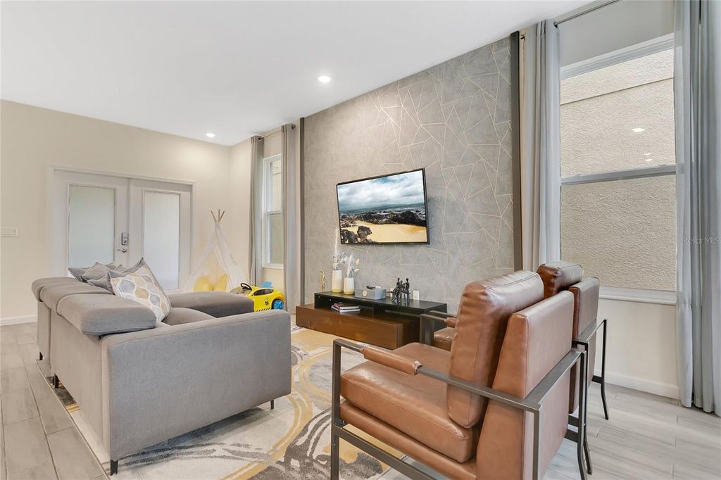 Photo of 262 Bella Prestwick Boulevard, Davenport, FL 33837 (MLS # O6400042)