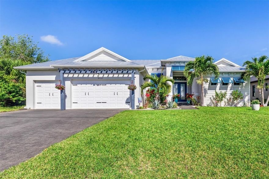 SIZE DOES MATTER! Get ready to fall in love with this amazing 2,443 SF waterfront home in the highly sought-after South Gulf Cove boating community, featuring 3 large bedrooms, 2 full bathrooms and office. A metal roof, Bahama shutters and automatic roll down shutters will give you convenience and peace of mind year-round.   The kitchen is equipped with quartz countertops, double-stack cabinetry, a huge hidden pantry, and SS appliances. The open concept living area features a beautiful, coffered ceiling and zero-degree pocket sliders. The spacious owner’s suite has direct lanai access and split walk-in closets. The master bath features a spa-like wet room design with a 3-head shower and freestanding tub enclosed behind sleek glass barn doors. Each of the large guest rooms has a walk-in closet. The full guest bath also acts as a convenient pool bath when entertaining. The laundry room is thoughtfully designed with a storage closet, utility sink, and additional cabinetry. The heated saltwater pool is surrounded by a generous paver lanai. There is a built-in outdoor kitchen and plenty of room for seating. Beyond the lanai is an irrigated and fully fenced St Augustine back yard that leads to the canal. There you will find a 30' dock, a 10K LB boat lift with canopy, newly wrapped pilings, an 80 ft. concrete seawall, and electric and water lines. The oversized three-car garage gives you plenty of space for vehicles, tools, toys, and storage. The garage also includes overhead storage, and the home is equipped with 50-amp power for generators. Beautifully maintained and full of sunny Florida charm, this move-in-ready home is also close to pristine beaches, world-class fishing, championship golf courses, wonderful restaurants, and great shopping. This beauty won’t last long—call me today for a private showing!