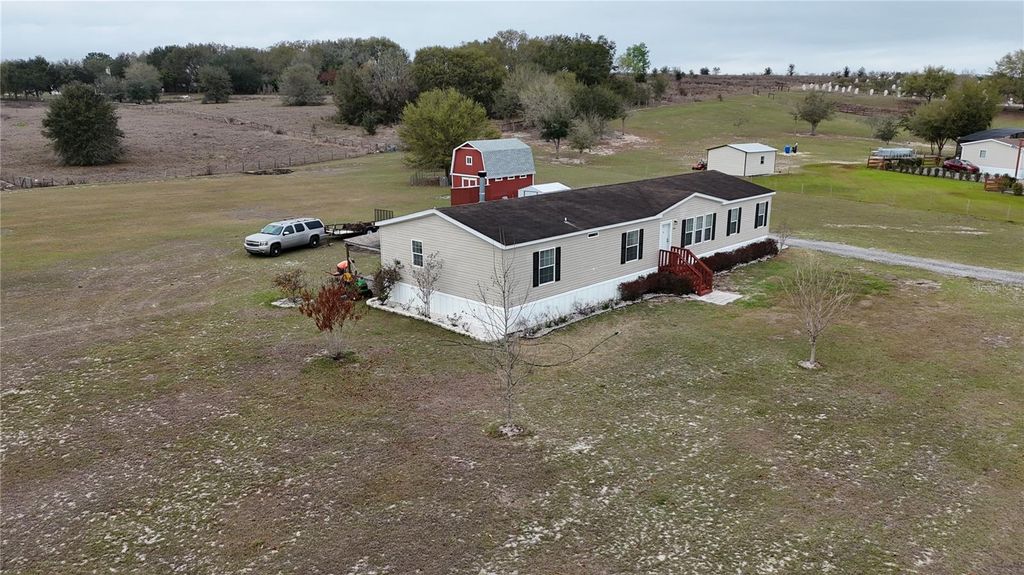 Photo of 8009 Sergeant Pepper Dr, Howey In The Hills, FL 34737 (MLS # G5108930)