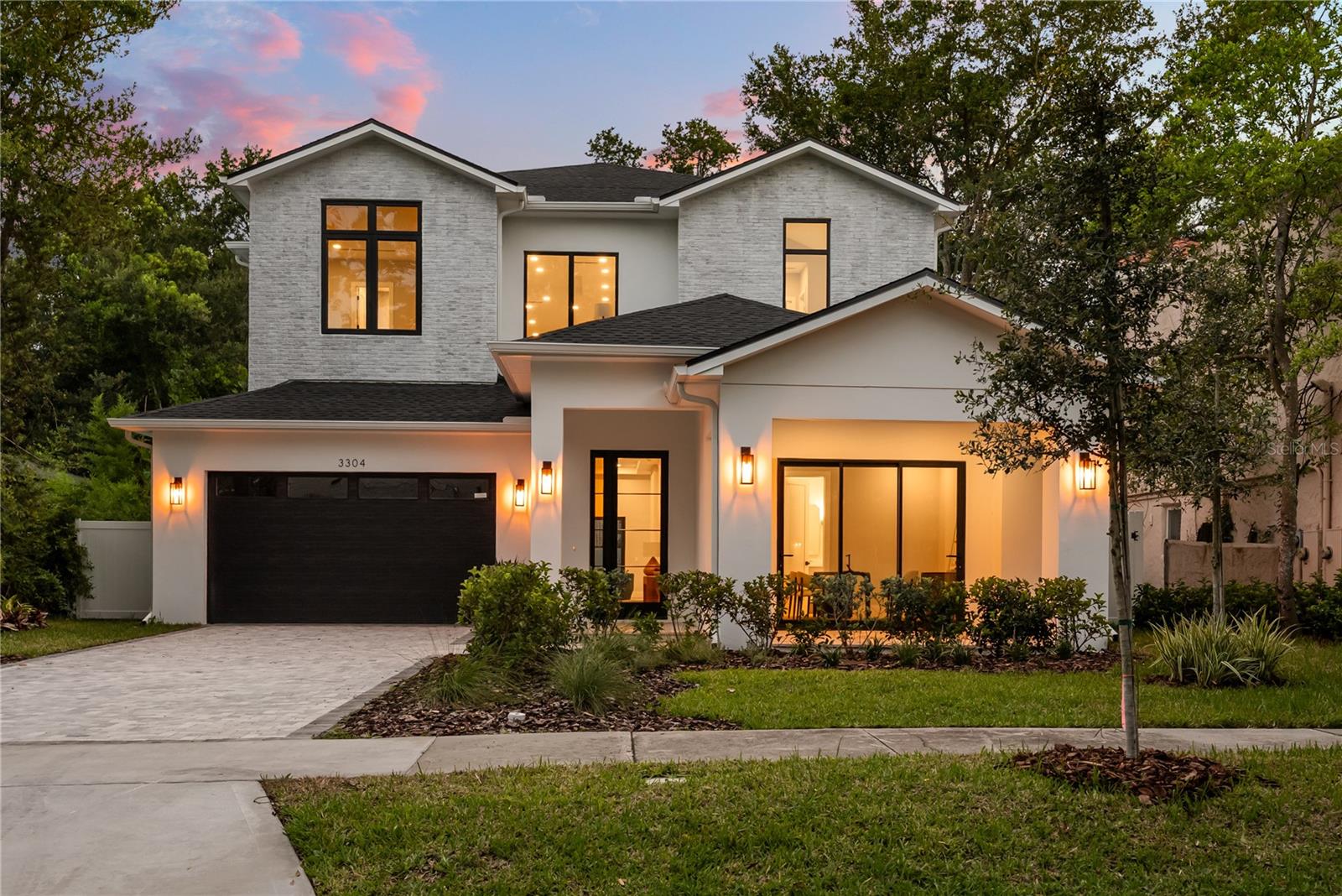 Under contract-accepting backup offers. Exquisite new construction by LUIH Homes, this architectural masterpiece redefines luxury living in the heart of College Park, just steps from the storied fairways of Dubsdread Golf Course. Thoughtfully designed with over 4,400 square feet of living space, every inch of this home exudes elegance, privacy, and sophistication. From soaring ceilings to custom millwork, glass railings, backlit wine rack, and striking LED lighting under each stair tread, every designer finish has been meticulously curated to impress. At the heart of the home lies a spectacular chefs kitchen outfitted with top-of-the-line Thermador appliances, a dramatic quartz waterfall island, and sleek custom cabinetry that flows seamlessly into open concept living and dining areas. The home offers two lavish primary suites, each with spa-inspired baths featuring freestanding soaking tubs, oversized rain showers, and boutique-style dressing rooms. Expansive glass doors lead to a private outdoor oasis, complete with an enormous, covered patio with a state-of-the-art summer kitchen, sophisticated lounge spaces, and an alfresco dining area that overlooks the sparkling pool and spa. Nestled on a rare 0.31-acre homesite with a sprawling backyard, this residence offers a level of space and privacy seldom found in College Park. Located just moments from College Parks celebrated shops, dining, and cultural charm, and a short drive to Winter Parks famed Park Avenue with its upscale shopping, fine dining, and cultural charm. This home is more than a place to live, its a statement of refined taste and elevated lifestyle.