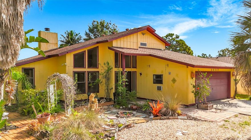 Outstanding Sarasota location for this truly unique lakefront home, complete with a small private dock. Nestled on a wooded, private lot, the setting offers a peaceful retreat that feels worlds away—yet is just minutes from everything Sarasota has to offer.
Inside, generous living areas and soaring ceilings create an open, airy atmosphere ideal for both everyday living and entertaining. There is ample space for gatherings, along with a versatile bonus area perfect for a study, den, or gallery. The main-floor primary suite features a walk-in closet for added comfort and convenience. The two-car garage is currently configured as a one-car garage with additional flex space that could serve as a bedroom or office and can easily be converted back to a full two-car garage. Two spacious upstairs bedrooms share a conveniently located bathroom. 
A large enclosed, air-conditioned lanai with French doors opens to a serene back patio, offering tranquil lake views and abundant wildlife. This home radiates warmth and character, reflecting years of cherished family and friend gatherings.
Located just one block from Bee Ridge Park, which offers basketball, volleyball, softball fields, and a shaded playground, and within a highly sought-after school district for elementary, middle, and high school. Sarasota Memorial Hospital is only three miles away, downtown Sarasota just five miles, and world-famous Siesta Key Beach approximately seven miles away—featuring exceptional dining, shopping, and cultural attractions. This property has never flooded and sits well above sea level.