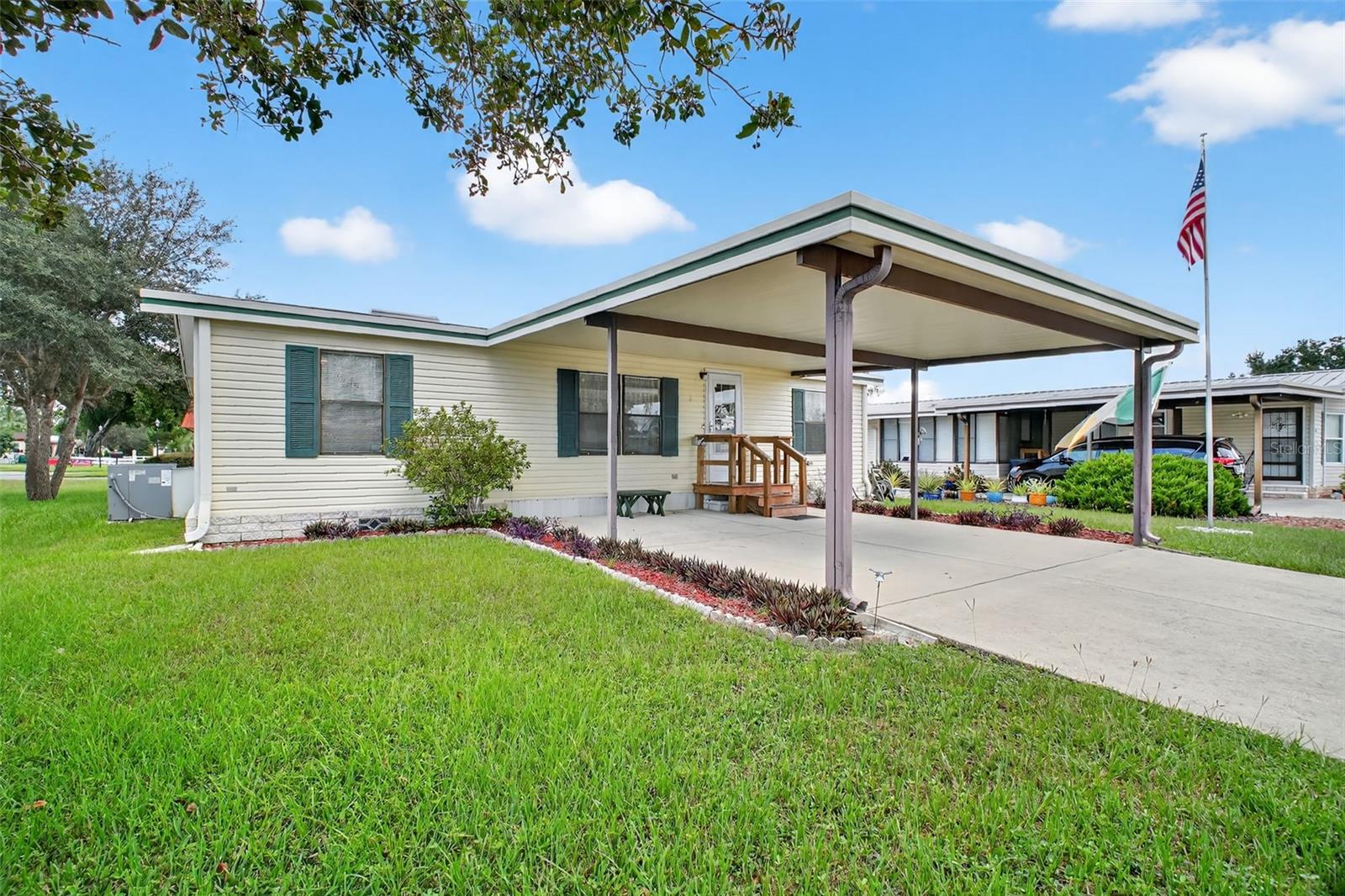 Located in the desirable Fox Run 55+ community, this well-maintained and partially furnished 3-bedroom 2-bath home is situated on a prime lot just a stone's throw from the Community Clubhouse and pool. As you walk in, you notice how open and efficient the living area flows into the kitchen and dining area, complemented by plenty of windows and natural light. The primary suite, located on the opposite side of the guest bedrooms, provides plenty of privacy when company arrives. It contains a walk-in closet, a single sink, and a shower. Need a dedicated office or hobby room; you have the option of using one of the guest bedrooms for that purpose. Enjoy the outdoors from your screened back porch located just steps away from the kitchen; a great place for morning coffee or a casual meal. all just a few steps away from the pool and clubhouse.. The storage area is conveniently located at the back of the home, has plenty of room for your mower or BBQ grill, with access to the oversized carport and driveway, all providing ample space for friends with cars and golf carts when visiting. Fox Run has a full social calendar centered around the clubhouse and its two pools and marina area, all for a very low monthly HOA fee. Enjoy access to the "Harris Chain of Lakes" from the community boat ramp and marina, or just enjoy fishing from the dock and boardwalk. Enjoy the "Fox Run Lifestyle", call and arrange for your private showing today.
