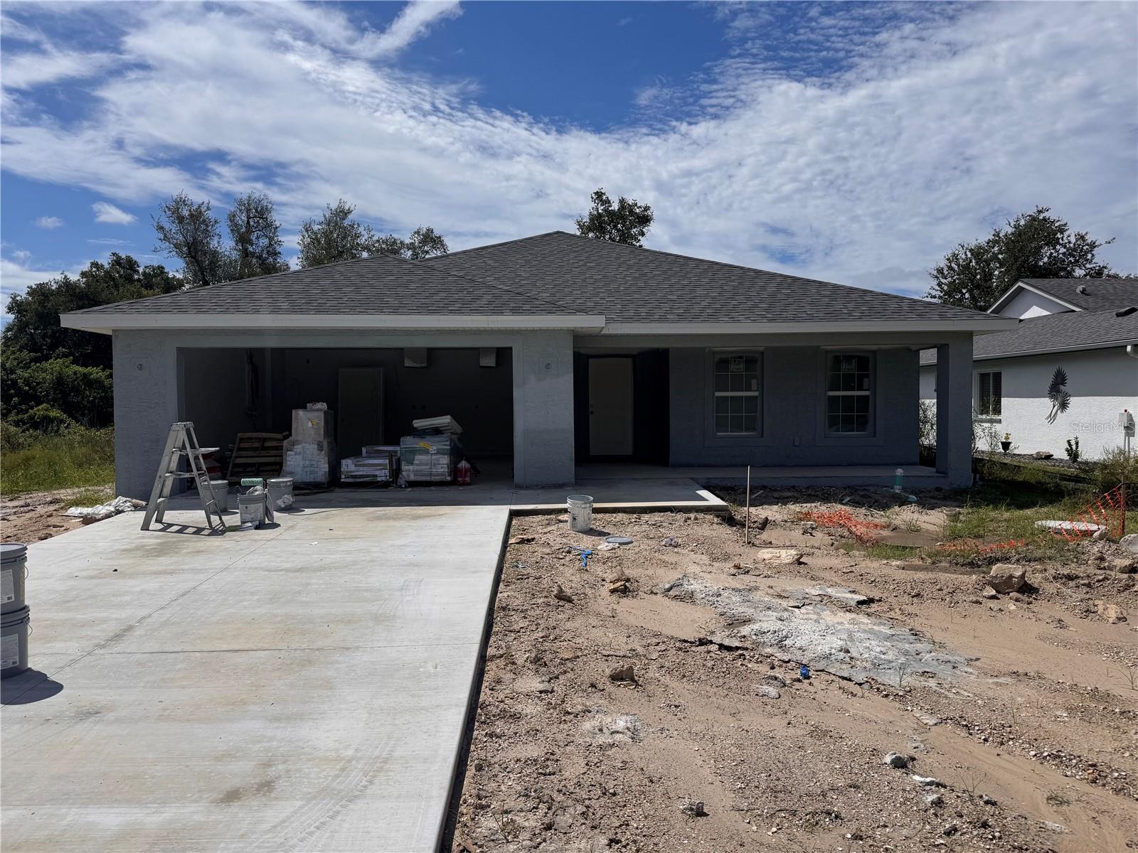 Under Construction. NO FLOOD ZONE...Our Model features an open floor plan from the minute you walk in the door. This home as 1752 sq foot of Living Space, 3 bedrooms, 2 baths and 2 Car Garage with a large Lanai. The open kitchen is perfect for entertaining, includes a spacious island, breakfast/dining area, and French Doors leading to the lanai to enjoy your morning coffee. The master bedroom includes a walk-in closet, Tiled shower, and Dual sink vanity. The 2 Guest bedrooms are located on opposite side of Master making it a split floor plan. Guest bathroom has a tiled shower/tub combo. The living room features cathedral ceilings. The home features plank tile throughout, granite countertops in the kitchen and bathrooms, recessed lighting, ceiling fans in every room, and Stainless Steel Appliances. The home comes with hurricane/storm shutters. COME VIEW THIS BEAUTIFUL HOME or CALL TODAY FOR AN UPDATED LIST OF OUR BUILDS! PLEASE NOTE - the pictures for this listing are a representation of the subject home being constructed. Interior and exterior paint colors, tile color, shingle colors, tray ceilings, fans, lights, manufacturer of appliances, interior/exterior door style, cabinets and landscaping are subject to change. Tax Information is for vacant land