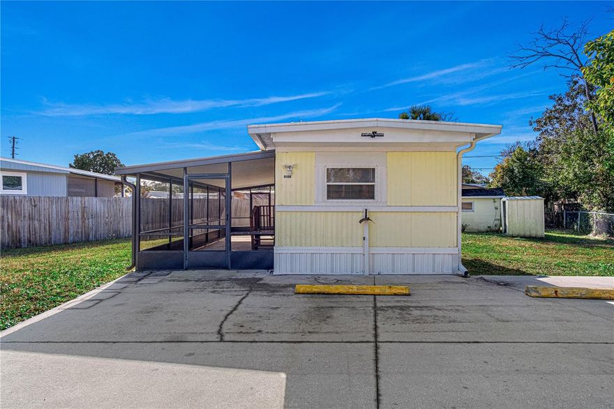 Move-in ready and meticulously maintained, this charming 1968 mobile home offers modern updates and excellent functional space. The interior features a bright, refreshed aesthetic with a white kitchen, new flooring throughout, and a clean, freshly painted palette. The layout includes 2 bedrooms and 1.5 baths, with a convenient half-bath located in the front bedroom. The exterior features a massive 41x9 screened porch, providing ample room for seating or storage, all situated on a fully fenced lot. For added convenience, there is an indoor washer hookup, while the dryer hookup is located in the storage shed just steps outside the back door. This is a solid, turnkey home for a buyer looking for a well-kept property. No HOA, Cash only. All information taken from the tax record, and while deemed reliable, cannot be guaranteed.