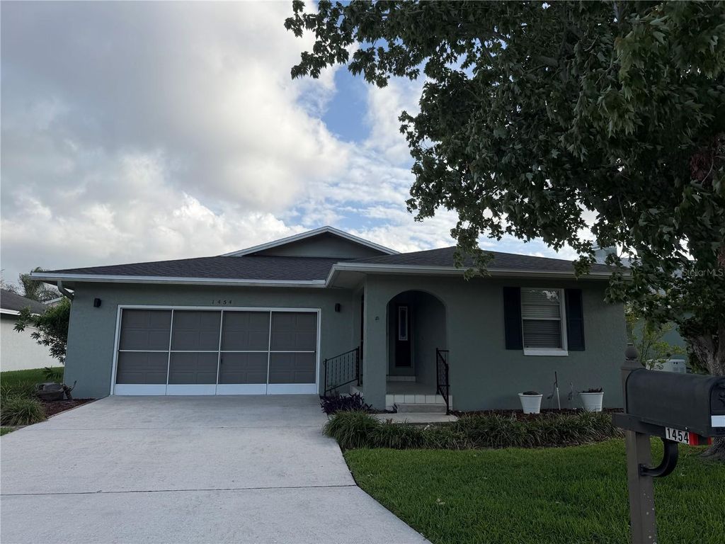 Photo of 1454 Grand Cayman Circle, Winter Haven, FL 33884 (MLS # O6396319)