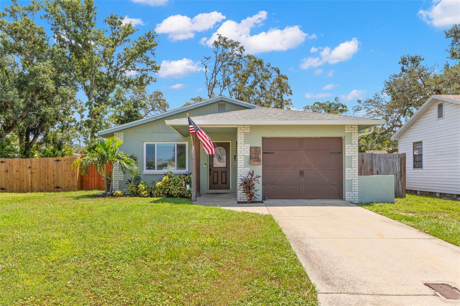 One or more photo(s) has been virtually staged. HIGH and DRY, NO CDD, NO HOA and in a NO FLOOD ZONE!! This CHARMING 3 bedroom, 1 Bathroom, 1 car garage block home offers not only a sense of comfortability but peace of mind. The curb appeal is a SHOWSTOPPER! A mixture of lush & tropical plantings including mature palm tree and colorful shrubbery will welcome you to the entryway through the front transom and glass inserted door. The kitchen is equipped with plenty of soft close cabinetry, pantry, all stainless steel appliances with ample enough space for a dinette set or breakfast nook. The living area has CAT 5 impact windows, plenty of space for entertaining family and friends, as well as, oversized furniture. Retreat out back to your home that sits on a generous lot, offering massive space for outdoor relaxation, gardening, or even future expansion. Additionally, keep shaded under the Gazebo and use the shed for all your storage needs. Hot Water Heater (2020), Roof and Exterior Paint (Nov 2021), freshly painted throughout and lastly the AC (2023). Located in a highly desirable area, this home is just minutes from downtown St. Pete, where an array of dining, shopping, and entertainment options await and just a short drive to award wining beaches. Conveniently just minutes from I-275, making it a quick commute to Tampa International Airport.