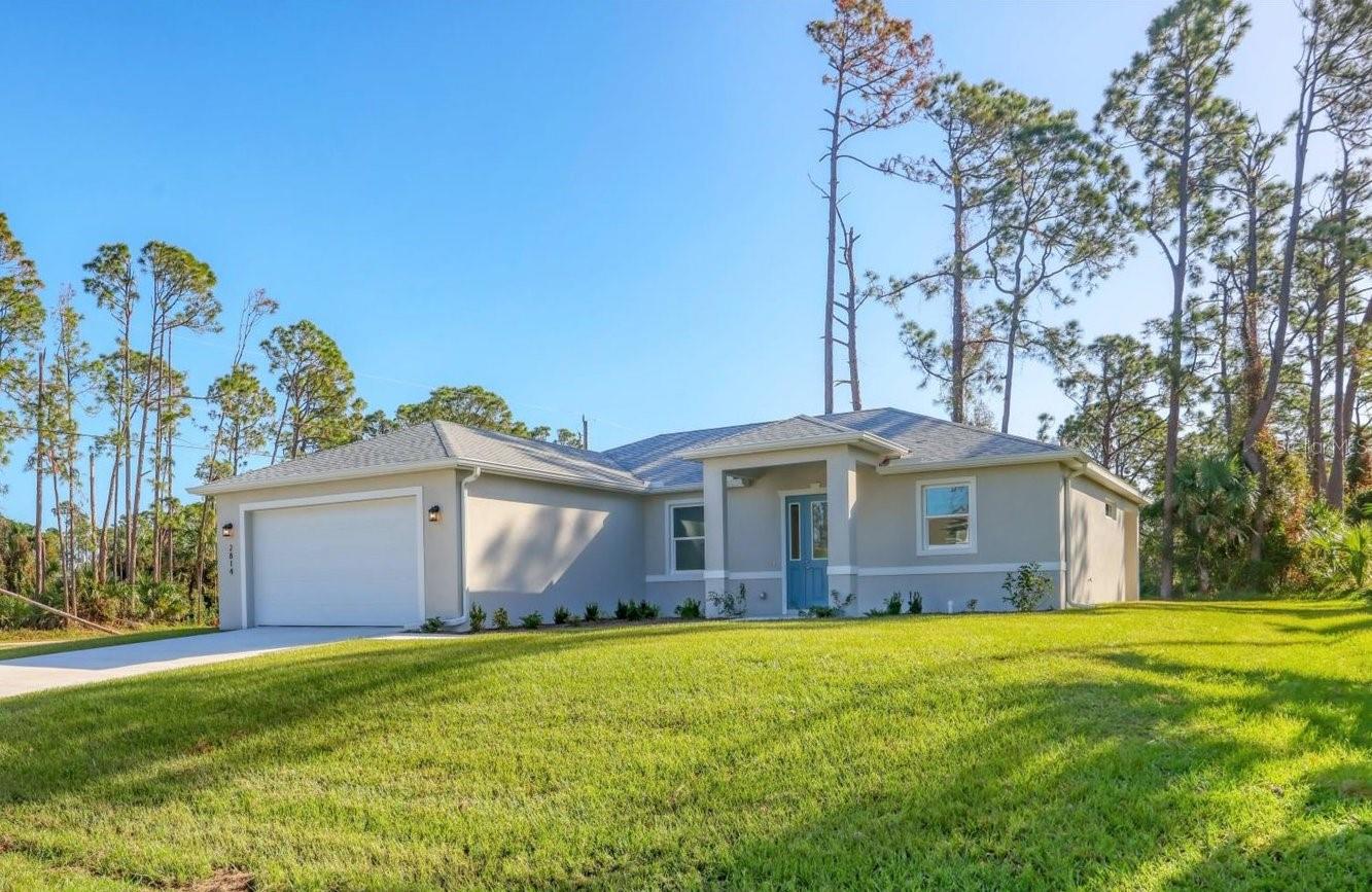 NEW CONSTRUCTION, situated on over a quarter-acre lot. SELLER FINANCING is available with 20% down. This beautiful 3-bedroom, 2-bath home offers a blend of modern design and exceptional quality, ready for its first owner. The open floor plan is bathed in natural light and showcases tile flooring throughout, 5-inch baseboards, and elegant tray ceilings. The thoughtfully designed layout connects the main living area to a dining space, with the kitchen conveniently positioned nearby. The kitchen features granite countertops, soft-close 42-inch cabinets, and brand-new stainless steel appliances, creating a functional and stylish space. French doors in both the living area and the primary bedroom lead to a spacious covered patio, perfect for relaxing or entertaining. The primary suite includes a walk-in closet and an en suite bathroom with dual sinks, granite countertops, and soft-close cabinetry. The secondary bathroom mirrors these high-end finishes, ensuring a cohesive design throughout the home. Built with durability and convenience in mind, this home boasts high-impact windows and doors, a water softener, and a high-impact garage door. The 2-car garage includes pull-down attic access, providing additional storage. Ideally located near beaches, dining, shopping, and hospitals, this home is the perfect combination of style, functionality, and convenience. Purchase with confidence as there is a 1 year, all encompassing, warranty included!