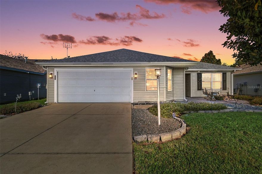 FABULOUS PARTIALLY FURNISHED 3/2 Designer Wisteria featuring a FRONT PAVER PATIO with FIRE PIT, SCREENED LANAI, and REAR PAVER PATIO - IDEALLY LOCATED - JUST MINUTES to LAKE SUMTER LANDING and all of the CONVENIENCES of County Road 466 (including the new Costco!) in the highly sought after Village of Winifred! BOND PAID! HWH (2023), ROOF (2019), WHOLE HOUSE SURGE PROTECTOR, and UPDATED IRRIGATION SYSTEM. Welcoming you into this INCREDIBLE home are MATURE LANDSCAPING with LOW-MAINTENANCE STONED planting beds and a FRONT PAVER PATIO with FIRE PIT - the perfect setting for RELAXING evenings under the stars! Enter through the COVERED VESTIBULE with storm door and sidelight into a generous inviting foyer. The FANTASTIC chef’s kitchen features TILE flooring, LIGHT WOOD cabinetry with PULL-OUT drawers, BUILT-IN pantry, STAINLESS steel appliances, GAS cooking, WINE COOLER, and a convenient EAT-IN breakfast bar. The adjacent dinette, highlighted by a bright BAY window, offers a charming space for casual meals filled with NATURAL LIGHT. The OPEN-CONCEPT living and dining areas showcase soaring VAULTED ceilings, beautiful LAMINATE flooring, and a SOLAR TUBE that enhances the home’s bright and airy feel. From the living room, sliding glass doors lead to a SPACIOUS SCREENED LANAI with painted floors, two ceiling fans, and an exterior door opening to the REAR PAVER PATIO - ideal for grilling and enjoying Florida’s outdoor lifestyle! The primary suite features LAMINATE flooring, DOUBLE windows, and TWO generous WALK-IN closets. It’s UPDATED en-suite bathroom includes LIGHT WOOD cabinetry with QUARTZ top, DOUBLE sinks, WALK-IN shower, and a LINEN closet. A SPLIT FLOOR PLAN with two additional bedrooms and a second bathroom ensures plenty of PRIVACY for guests or a quiet home office. Bedrooms two and three both offer LAMINATE floors, DOUBLE windows and built in closets. The second bathroom features LIGHT WOOD vanity, TILED tub and shower combination, and a hallway LINEN closet. A centrally located INTERIOR LAUNDRY ROOM boasts WHITE cabinetry, shelving, and a UTILITY sink. The TWO-CAR garage completes the package and features NEWLY SCREENED SLIDING GARAGE DOOR PANELS, a WHOLE HOUSE WATER FILTRATION and SOFTENER SYSTEM and PLENTY of room for parking and storage! This INCREDIBLE home is presented partially FURNISHED! (Exclusion list available) DON’T MISS YOUR OPPORTUNITY to make it YOUR OWN! The Village of Winifred offers an UNBEATABLE LOCATION - Close to Lake Sumter Landing and Spanish Springs Town Squares; Laurel Manor Regional Recreation Center; Winifred Neighborhood Pool; Palmer Legends Country Club and Championship Golf Course; Saddlebrook Softball Complex; and CR 466 with an abundance of shopping, dining, banking, medical, and more! PLEASE WATCH OUR WALKTHROUGH VIDEO of this AMAZING HOME and call today to schedule your Private Showing or Virtual Tour!