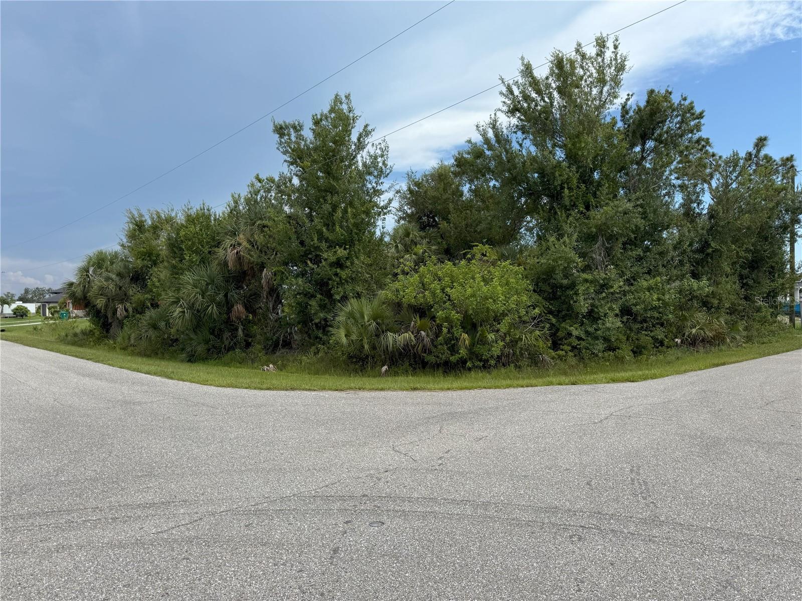 OVERSIZED CORNER DUPLEX LOT City water and sewer available! No Scrub Jays at the time of the listing! Canal in the back. The property is located in South Gulf Cove with a public boat ramp and over 50 miles of navigable waterways for you to enjoy. The Community offers multiple parks, a playground and sidewalks for your everyday enjoyment.