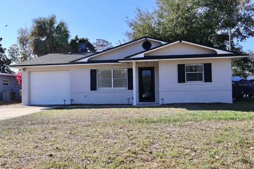 Lake life starts here! Experience True Lake life on Florida's largest chain of lakes (Harris Chain)  This charming retreat offers water views from your kitchen & family room as well as bedroom & covered & screen enclosed back patio with direct access from your backyard dock.  Lake Harris Shores has the deepest & widest canals in the entire Chain & these lakes & canals can get you all the way to Silver Glen off the St John’s River!  Whether you are looking for a weekend escape or full time residence,  the possibilities are endless!  From your backyard You can cruise to one of the 13 restaurants for lunch or dinner, enjoy a day of fishing or participate in water sports on one of the 12 lakes totaling over 75,000 acres of water!  This chain of lakes hosts some of the largest bass fishing tournaments in the country.  Since purchase in 2022 owners have replaced the roof (June 2022)  electrical panel, garage door, fresh paint inside and out, new shutters, epoxy on garage floor, new oven, pavers in back yard, outdoor shower & partial fence was recently as well.  Lake Harris Shores dues are only $700 a year and they include water so no water or sewer bill to worry about plus you can enjoy a clubhouse on Little Lake Harris with plenty of activities.  Who says money can’t buy you a single-family home on the largest chain of lakes in the state of Florida. Schedule your appointment today before it’s too late.