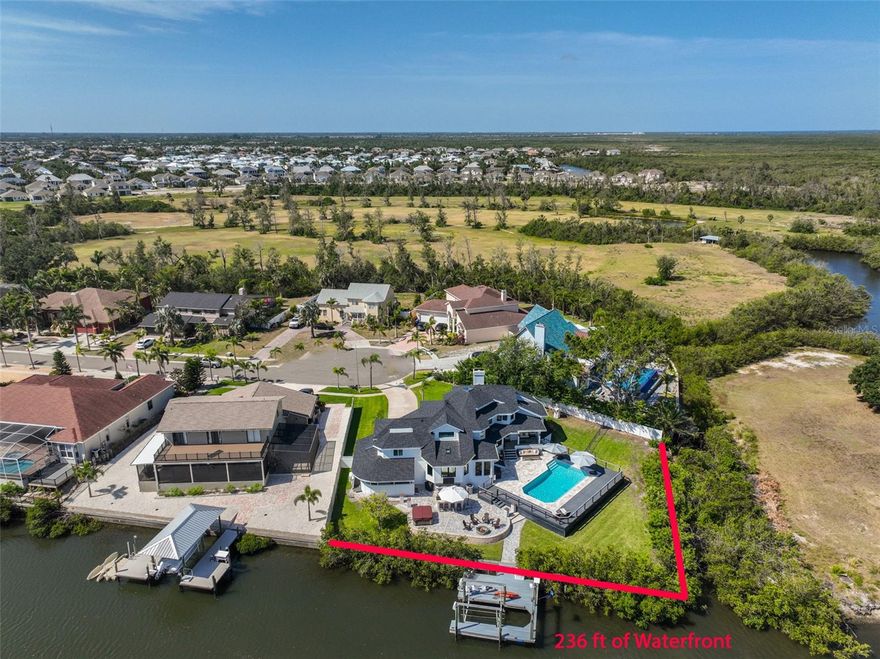 236 ft of WATERFRONT with DIRECT ACCESS TO TAMPA BAY!  Waterfront OASIS! Live the Ultimate Lifestyle in Apollo Beach + No CDD/HOA Fees! 4 Bedrooms | 3.5 Bathrooms | 3,398 Sq Ft | Pool + Hot Tub + Private Dock + Boat Lift. Welcome to your dream coastal escape, a truly unique home offering 4 bedrooms, 3.5 baths, and 3,400 square feet of beautifully designed living space. Nestled just off Tampa Bay in Apollo Beach, this architectural gem blends upscale design with laid-back waterfront charm, creating the ultimate Florida lifestyle experience. WATERFRONT PARADISE: Step outside and you're instantly on vacation. Fish from your private dock, cruise the bay from your boat lift, or cool off in the resort-style pool. Grill the catch of the day in your fully outfitted outdoor kitchen, gather around the fire pit with friends, or kick back under one of the three spacious covered lanais. With a fenced yard for pets and a reimagined beachy lounge area, this backyard was built for sun-soaked days and starry nights. BREEZY, BRIGHT INTERIORS: Step through the front door into a light-filled coastal retreat. Engineered wood plank flooring carries a modern, natural vibe throughout. NEW top-of-the-line hurricane-impact windows and skylights flood the home with sunshine while offering peace of mind during storm season. Plantation shutters add charm and functionality, while the NEW roof provides long-lasting durability. UPSTAIRS RETREATS: Up the grand double staircase, discover multiple reading nooks and serene sleeping quarters. The primary suite is a true retreat with vaulted ceilings, exposed beams, and an updated spa-style en-suite bath with walk-in shower, lit vanity, and porcelain tile accents. The sitting area in the primary is ideal for a Peloton, nursery, or private escape. Two more upstairs bedrooms offer vaulted ceilings and charming nooks, while a separate guest suite with its own staircase, en-suite bath, and water views makes for the perfect visitor space or multigenerational living. MORE TO LOVE: This home includes an oversized 2-car garage, a separate 200 sq ft air-conditioned office space, perfect for working remotely,and something almost unheard of in Florida: an oversized basement offering incredible storage or future possibilities. This is more than just a home; it's a coastal lifestyle. From morning boat rides to sunset dinners on the lanai, this stunning property is a one-of-a-kind opportunity to bask in the ultimate setting of peace, privacy, and pure Florida magic. Come see why homes like this don't come around often.