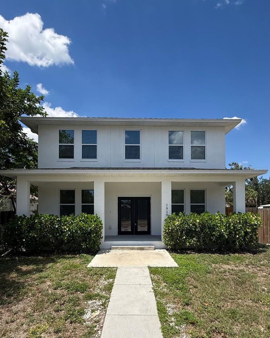 MOTIVATED SELLER offering a 2024 residence with a separate detached ADU generating stable rental income in St. Petersburg. The detached unit is currently leased for $2,600 a month through February 2027, creating an excellent opportunity for buyers seeking supplemental income, multi-generational living, or an investment-focused property. Inside the main residence, the home showcases a bright and spacious floor plan with 5 bedrooms and 3 bathrooms designed for comfortable modern living. The kitchen serves as the centerpiece of the home with an oversized island, walk-in pantry, shaker cabinetry, and stainless steel appliances, all opening seamlessly to the main living and dining areas. Covered front and rear porches create additional outdoor living space, while the upstairs bonus room and dedicated laundry room add functionality. The primary suite offers a private retreat with a large walk-in closet and a well-appointed bathroom featuring dual vanities, a soaking tub, and a frameless glass shower. Positioned separately from the main house for additional privacy, the detached ADU includes its own utility meters, dedicated HVAC system, private entry access, covered balcony, and full kitchen. The upper level contains 2 bedrooms and 2 bathrooms, while the lower level offers a versatile flex space with an additional full bath and attached garage suitable for a fitness room, workspace, media room, or storage. The fully fenced property includes multiple off-street parking spaces and is conveniently located near downtown St. Petersburg.