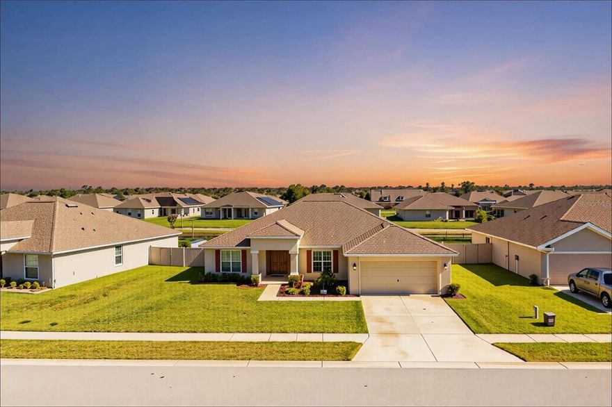 This stunning 4-bedroom, 2-bathroom home, built in 2021 by Southern Homes, is located in an exclusive gated community that has direct access to Lake Rochelle's boat ramp. Featuring an open floor plan with vaulted ceilings, the living, dining, and kitchen areas flow seamlessly, creating the perfect space for entertaining or relaxing.This 2,432±sf home is ideal for families and is just steps away from a community playground. Inside the 1,847±fl of living area, you’ll find a bright, open-concept living and dining space—perfect for both relaxing and entertaining guests.The large kitchen is a true centerpiece, featuring elegant hardwood cabinetry, a large island with a convenient breakfast bar, and generous counter space that makes cooking a joy. A dedicated laundry room enhances functionality and ease of living.Retreat to the spacious primary suite, which offers a large walk-in closet and a spa-inspired ensuite bath with dual vanities, a garden tub, and a separate walk-in shower.Step outside to a fully fenced backyard that provides both privacy and space for outdoor fun or pets to roam. The home backs onto a peaceful retention lake, offering tranquil views and no rear neighbors.Upgrades include the PVC fencing, covered rear screen porch with paver patio, solid surface kitchen counters & full height kitchen cabinetry.  The ac was just serviced, Refrigerator & dishwasher are less than a year old. With its upscale finishes, serene setting, and unbeatable access to the water, this home is truly a rare gem. Schedule your private tour today and experience lakefront living at its finest!
