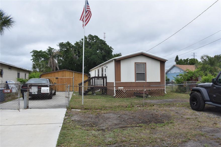 FULL LAND OWNERSHIP! NOT in a Co-op or HOA! Charming manufactured home on a private lot in Pinellas Park with full land ownership- that means NO lot rent, and NO HOA fees! The 2 bedroom, 1 bathroom home features a split floor plan with 658 sqft of living space and INTERIOR LAUNDRY! Recent upgrades include a NEW A/C system installed just a few months ago, and the roof replaced in 2013 with lifetime warranty for buyer's added peace of mind. Additional features include a water softener, a custom-built detached wooden garage/workshop with concrete slab (perfect for vehicles, hobbies, or storage!) deck/back porch for outdoor enjoyment, and a separate storage shed. Fully fenced yard ensures security for pets, and the newer concrete driveway adds curb appeal while providing easy access to the home and garage.
Conveniently located with quick access to major roads, countless restaurants, shopping, and our world-famous beaches. Ideal for affordable homeownership, local builders, or as a great, move-in ready investment property. Don't miss out on this incredible ownership opportunity on its OWN PRIVATE LOT!