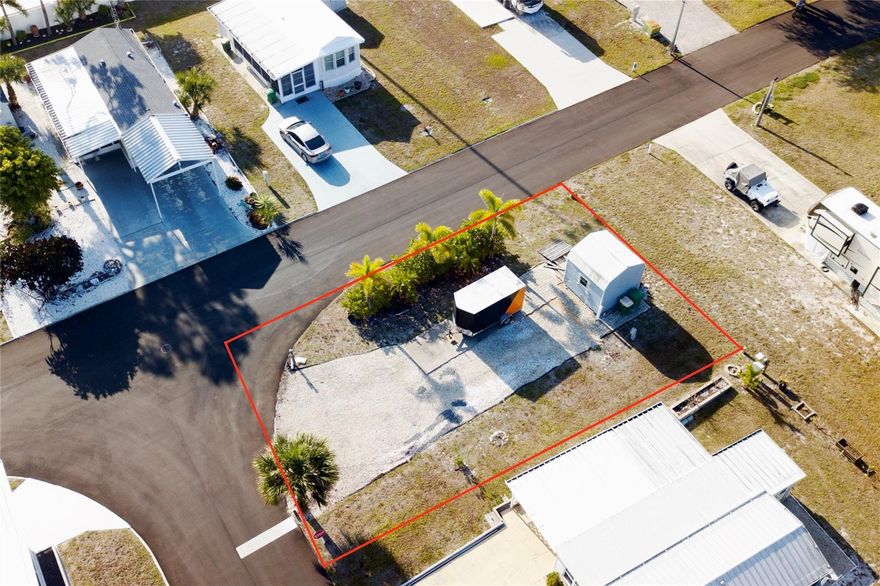 Vacant Lot with Gulf Access in the highly desirable Oyster Creek Mobile Home Park. Situated within an active 55+ community in Englewood, this property features a spacious concrete pad ready to accommodate a mobile home, park model, or motorhome, along with city water and sewer connections already in place. A newer storage shed provides additional convenience and for added peace of mind, the lot is located within a X flood zone.

The low monthly fee includes lawn maintenance, on-site property management, access to the community clubhouse, boat docks, and a designated storage area for RVs and boats. This pet-friendly, golf cart-friendly community also offers a private boat ramp, dock, and fishing pier with direct access to the Intracoastal Waterway and the Gulf of Mexico, with only one bridge to navigate—ideal for boating and fishing enthusiasts.

Nearby, Ann Dever Memorial Park provides a public swimming pool, walking trails, picnic areas, and a variety of recreational opportunities. The property is also conveniently located near golf courses, restaurants, shopping, and the renowned fishing waters of Charlotte Harbor and Boca Grande.

Whether you are seeking a full-time residence or a seasonal retreat, this property at 70 Bull Bay Ln. offers an exceptional combination of location, amenities, and value.