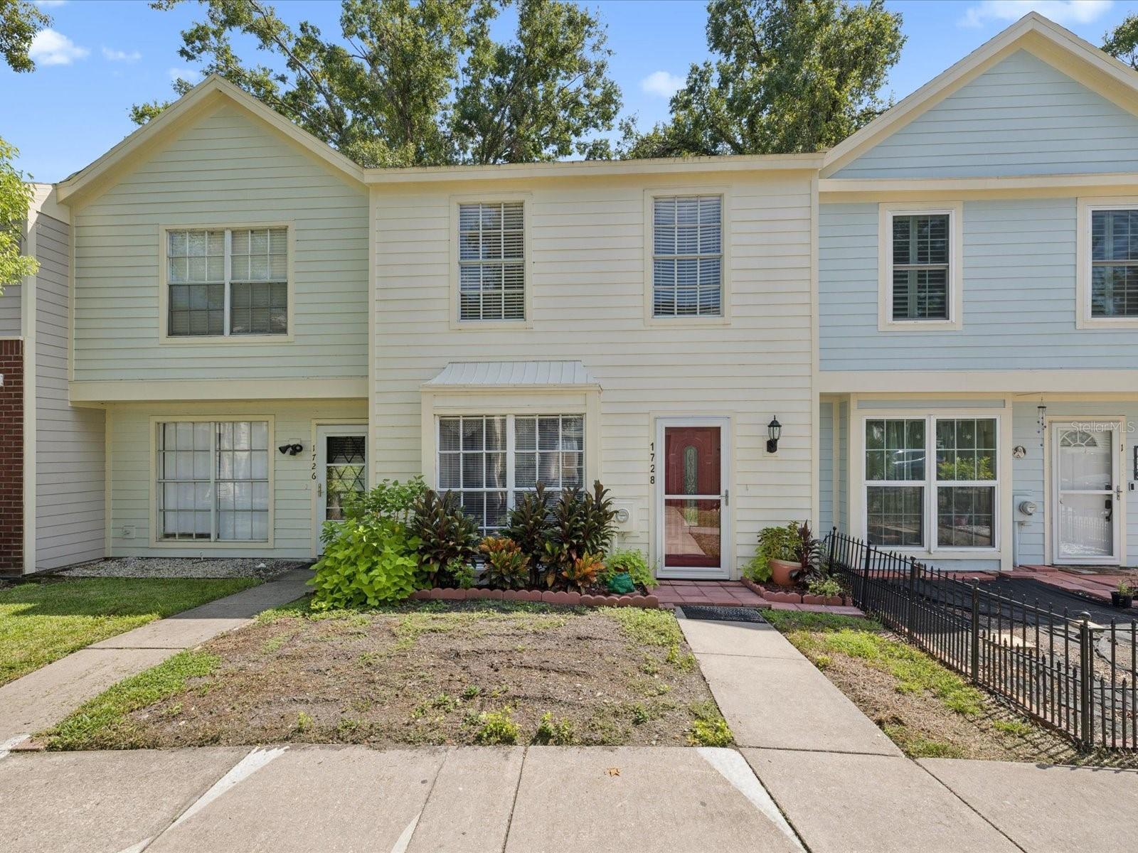 Welcome to this charming 2-bedroom, 2.5-bath townhome nestled in a quiet, well-maintained community featuring a sparkling pool and tennis courts. The main floor boasts laminate flooring and opens to a large, fenced patio with a storage room, perfect for outdoor entertaining. Recent upgrades include new exterior siding, adding to the home’s appeal and durability. The HOA provides peace of mind by covering roof replacement, pest control, sewer, water, and trash service. Upstairs, you’ll find two spacious bedrooms, each with its own private bathroom, ideal for comfort and convenience. Located just minutes from major highways, shopping centers, grocery stores, and a variety of restaurants, this home offers unmatched accessibility. Sports fans will love being close to both the Buccaneers’ and Rays’ stadiums, as well as USF. For outdoor recreation, you’re less than 5 miles from Carrollwood Village Park, where walking trails, splash pads, playgrounds, and dog parks await. This townhome combines low-maintenance living with unbeatable location—a must-see in the heart of Tampa!