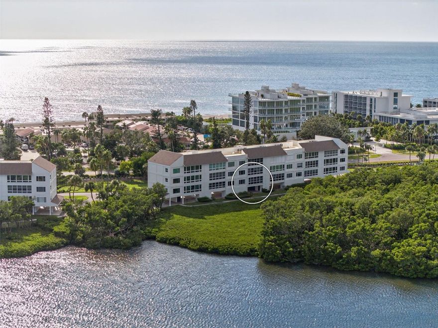 Welcome to your island retreat, an impeccably renovated 2-bedroom, 2-bath residence offering luxury Longboat Key living at its finest with preserved mangrove and Sarasota Bay views. Every detail has been thoughtfully updated ,this home has been renovated from top to bottom, featuring new flooring, new plumbing, new electrical, new lighting, hurricane-impact windows with shutters for peace of mind and MORE! The brand-new kitchen showcases quartz countertops, custom cabinetry, and all-new stainless-steel appliances, creating a beautiful space that opens to the bright and airy living area. Both bathrooms have been updated with modern finishes and quarts countertops as well. A Murphy bed in the office area adds versatility, perfect for guests or additional workspace. Enjoy deeded beach access directly across the street for endless days on the sand, or take advantage of boat slips available for residents, ideal for boaters looking to explore Sarasota Bay and the Gulf. Windward Bay is a pet-friendly, amenity-rich community offering multiple pools, tennis and pickleball courts, a fitness center with sauna, kayak storage, and walking paths along the bayfront. Perfectly situated near world-renowned restaurants on Longboat Key, St. Armands Circle, and Anna Maria Island, this home combines effortless luxury with the ultimate coastal convenience. Move-in ready and maintenance-free, your Longboat Key lifestyle awaits!