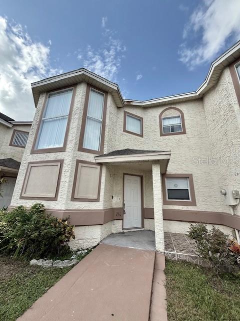 Discover this charming 2-bedroom, 3-bath townhome in Buena Ventura Lakes, offering more than 1,400 sq. ft. of well-planned living space. The main areas feature ceramic tile for easy maintenance. The kitchen completely equipped, and a bright bay window along the stairwell creates a welcoming spot that’s perfect for a small desk or reading nook. The separate dining room opens to the outdoors through sliding glass doors, filling the space with natural light. Upstairs, both bedrooms enjoy their own en-suite bathrooms and private balconies overlooking a peaceful pond—an ideal retreat at the end of the day. With close proximity to shopping, dining, and public transportation, this townhome combines comfort with convenience.