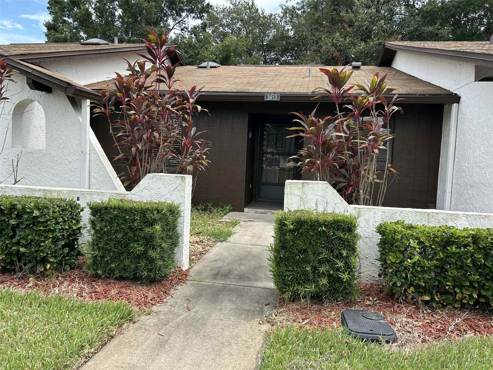 This beautiful little community is tucked away right in the center of town! With one way in and one way out, there is very little traffic on the street. The property has a large living space with 2 carpeted bedrooms and a beautifully tiled kitchen. Sizeable back porch with all-season windows provides some extra living space and even has a storage area inside. AC was replaced in December of 2020. Community offers a clubhouse area with a pool to relax in! HOA covers all exterior maintenance and lawn care, offering a nice worry-free lifestyle. This place is ready for you to call it home!