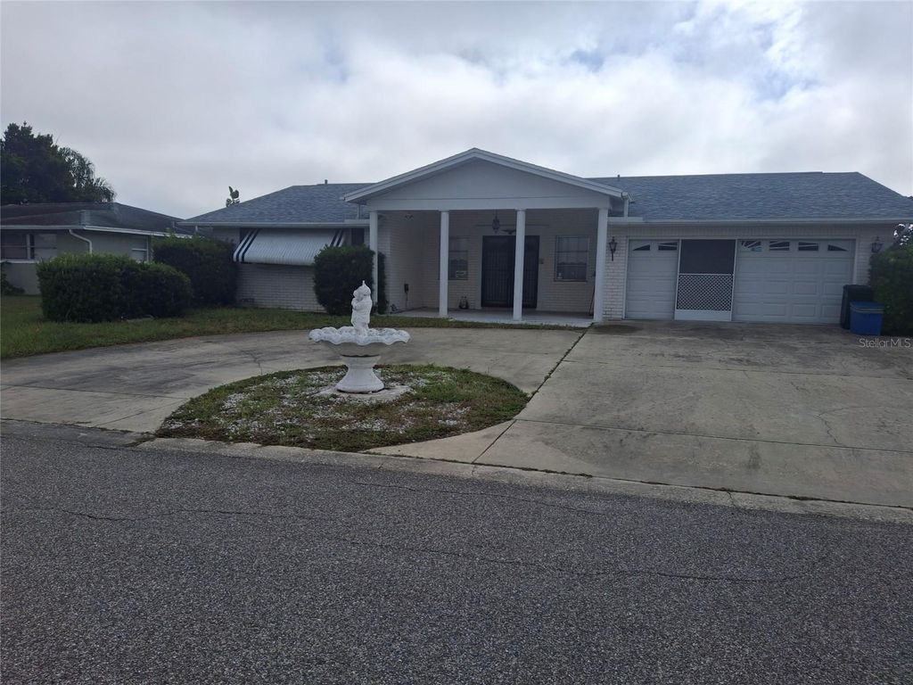 Photo of 10200 Amadeus Drive, Port Richey, FL 34668 (MLS # W7879370)