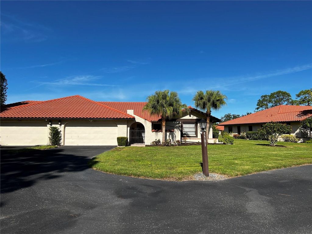 Photo of 5581 Golf Pointe Drive, Sarasota, FL 34243 (MLS # A4678276)