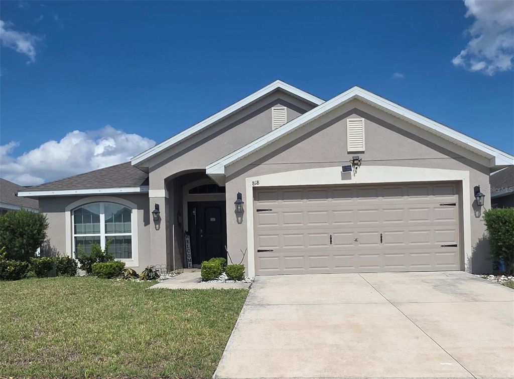 Photo of 818 Landmark Hills Drive, Haines City, FL 33844 (MLS # S5148168)