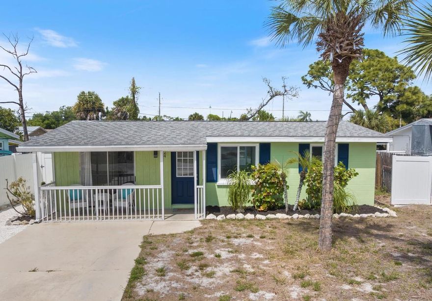 Charming Cottage house in the heart of Englewood, just blocks from historic Dearborn Street! This adorable home has been FRESHLY PAINTED inside and out, and features updated luxury vinyl flooring, new trim and baseboards, granite counters, travertine backsplash, wood cabinets, mounted TV shelves, and bright shell 'beachy" landscaping! This home makes a great starter home, or a fantastic vacation getaway! Peace of mind with updates with HURRICANE WINDOWS installed 2022, A/C installed 2023, water heater 2025, and a 2017 roof, plus X500 FLOOD ZONE - NO FLOOD INSURANCE NEEDED! NO HOA, NO CDD, so bring your boat! A large fenced backyard features an entertaining deck, fire pit ready to go, enclosed lanai, and a storage shed for all your beach gear and tools! LOCATION, LOCATION! You're just minutes from all the fabulous activities of Dearborn Street, and the famous Indian Mound Park is just a little over 1 mile away offering a boat ramp, kayak put in, fishing, and picnic shelters! LOVE THE BEACH? Englewood Beach is only 3.5 miles south! This home would also be a great rental income property, area homes show great rental history! Don't miss your chance to tour the adorable "GREEN HOUSE on GREEN STREET!" Call today for a private showing.