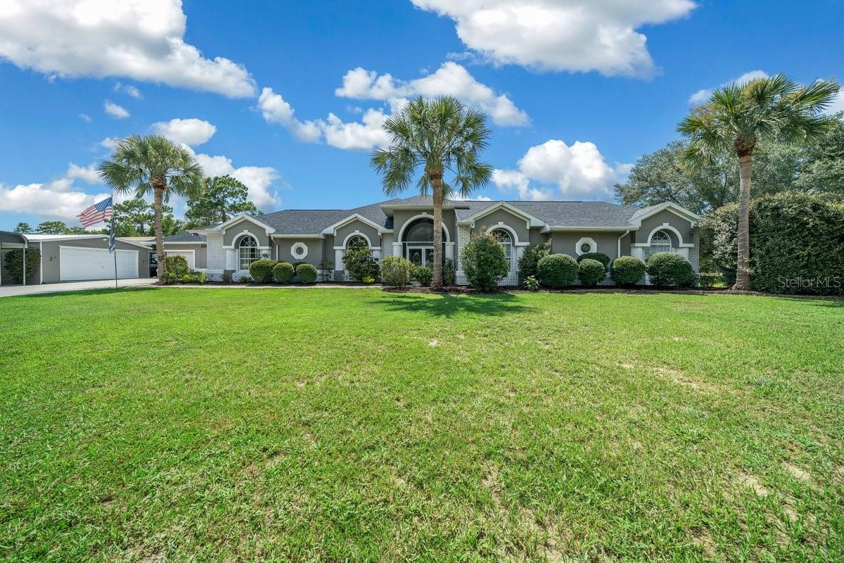 Welcome Home—Where Luxury Living Begins by the Pool | Now Offered at $865,000
Step through the poolside lanai and into your own private cabana-style sanctuary in the sought-after Pine Ridge community. From the moment you enter through the heart of this home—its resort-style pool and spa—you’ll feel like you’ve arrived at a private retreat designed for year-round relaxation and fun.
Surrounded by brand-new screened enclosures and powered by a WiFi-enabled pool system with heater and spa, this stunning outdoor area sets the tone for the entire home. Whether you're soaking in the spa after a long day or entertaining friends under the stars, this space is the perfect centerpiece for your indoor-outdoor lifestyle.
Inside, the freshly painted interior is warm, inviting, and filled with natural light. The unique layout offers privacy and flexibility: two bedrooms and a full bath are located on one side of the pool, while the main living area, primary suite, and an additional guest bedroom are situated on the opposite side. The two sections are connected exclusively through the pool area, creating a true cabana-style flow that’s both functional and distinct.
This home has been thoughtfully updated to combine modern convenience with rural charm. A new roof was installed in 2020, along with a new septic field installed this year, providing peace of mind for years to come. The property also includes a yard hydrant, ideal for gardening, horses, or other animals, making it well-suited for those who value space and versatility. Instead of a traditional surround sound system, you’ll enjoy a smart WiFi-enabled intercom system, allowing you to stream music seamlessly throughout the home. A cozy fireplace in the main living space adds warmth and ambiance during the cooler months—all while keeping your view of the sparkling pool front and center.
Sitting on 4.07 private acres with no HOA, this home offers the perfect balance of privacy, functionality, and resort-style living. Now attractively priced at $865,000, it's more than just a home—it’s your everyday getaway in one of Citrus County’s most desirable communities.