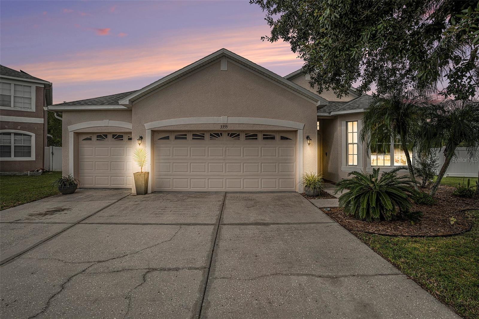 Beautiful 4 bedroom, 3 bath, 3 car garage home in the community of Concord Station in Land O Lakes, Tampa's northern suburb. This 1 story home has stunning views of water and conservation from the living room, master bedroom, 4th bedroom and the covered/screened porch. This home features a gorgeous remodeled kitchen with quartz countertops, large island, breakfast bar, cooktop, plenty of cabinets and breakfast nook. The high ceilings throughout the living space creates an open and airy feeling. The split floor plan layout features a Primary Suite with his and hers walk-in closets, en suite bathroom with a dual vanity, large tub and substantial walk-in shower. This home is well-maintained with brand new ceramic tile flooring throughout. The roof was replaced in 2022 and A/C in 2021. Located with 'A' and 'B' rated schools, with both middle and high school conveniently located just outside the neighborhood. COMMUNITY AMENITIES: Pool, Fitness Center, Clubhouse, Tennis & Basketball Courts. LOCATION: Conveniently located near 589 Veterans/Suncoast Parkway, 5 minutes to Publix, 10 minutes to Walmart, 30 minutes to Tampa International Airport, 35 minutes to Downtown Tampa and close to all the restaurants, shopping and entertainment for which the Tampa Bay area is known. Schedule your showing today!