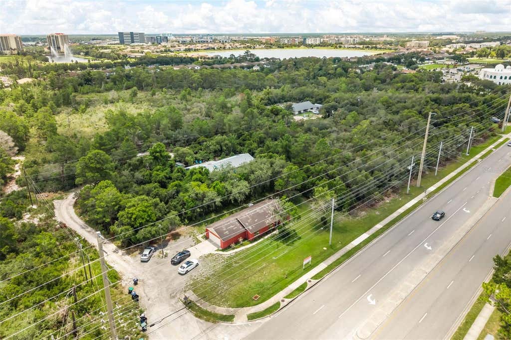 Photo of 11253 S Apopka Vineland Road, Orlando, FL 32836 (MLS # O6428305)