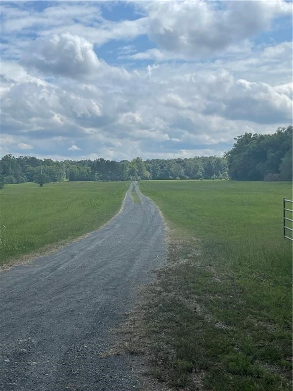 View of dirt / gravel road featuring a view of cou