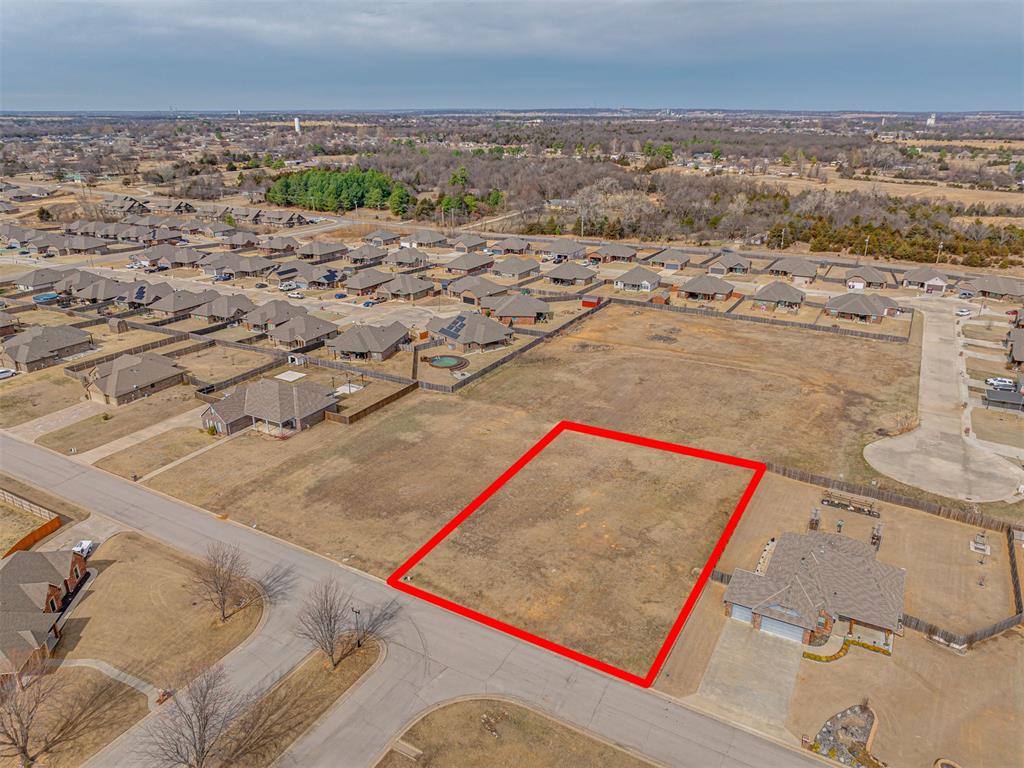 Aerial view of residential area with property parcel outlined