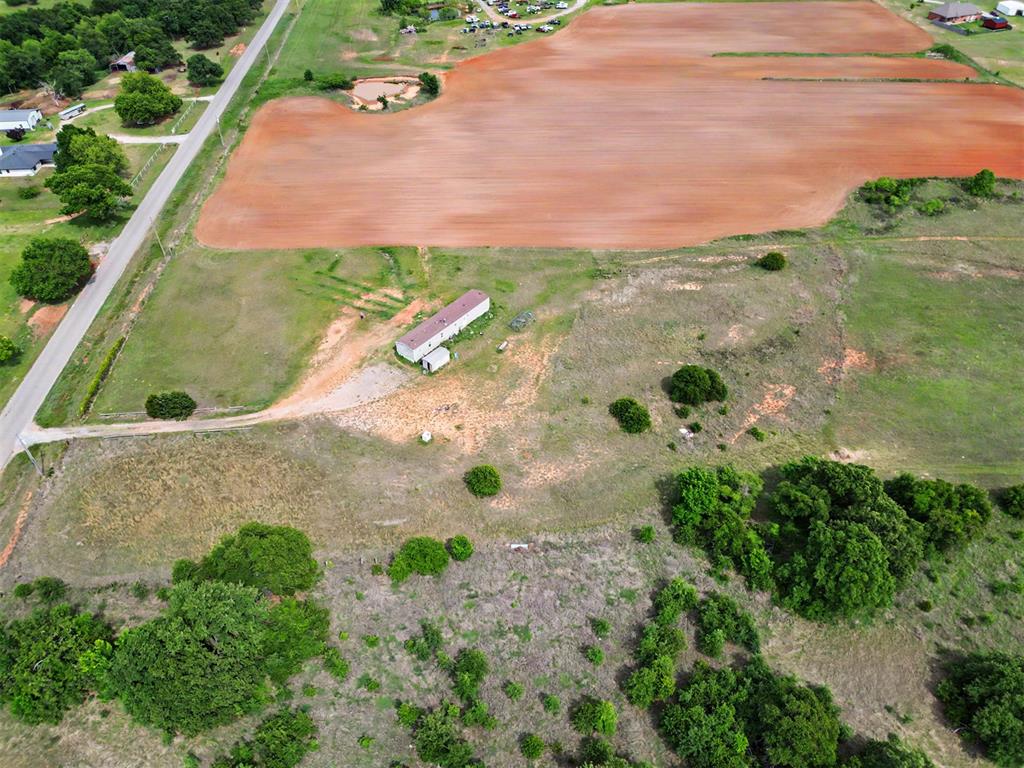 Expansive parcel featuring a mix of open land and mature trees