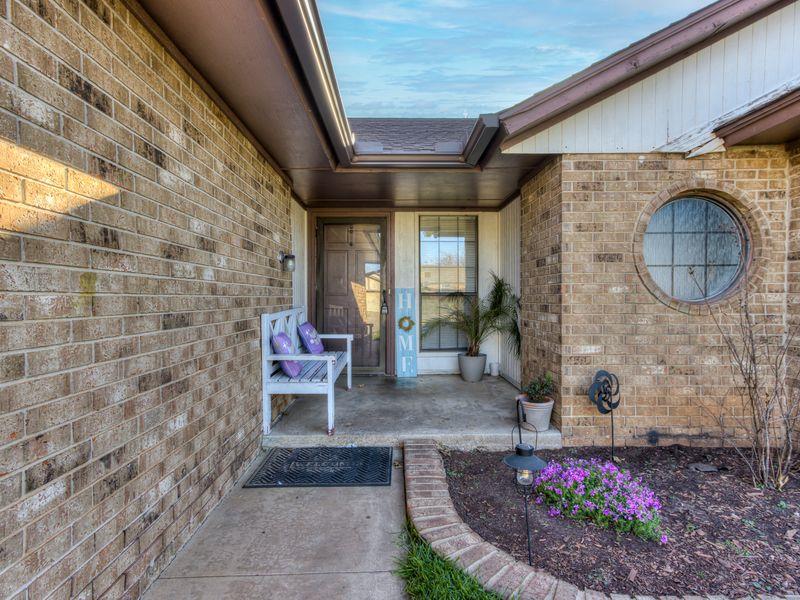 Entrance to property featuring brick siding