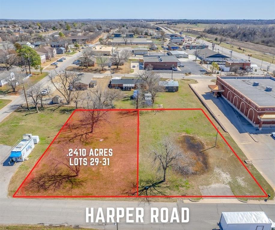 Aerial view of property and surrounding area featuring property boundaries highlighted